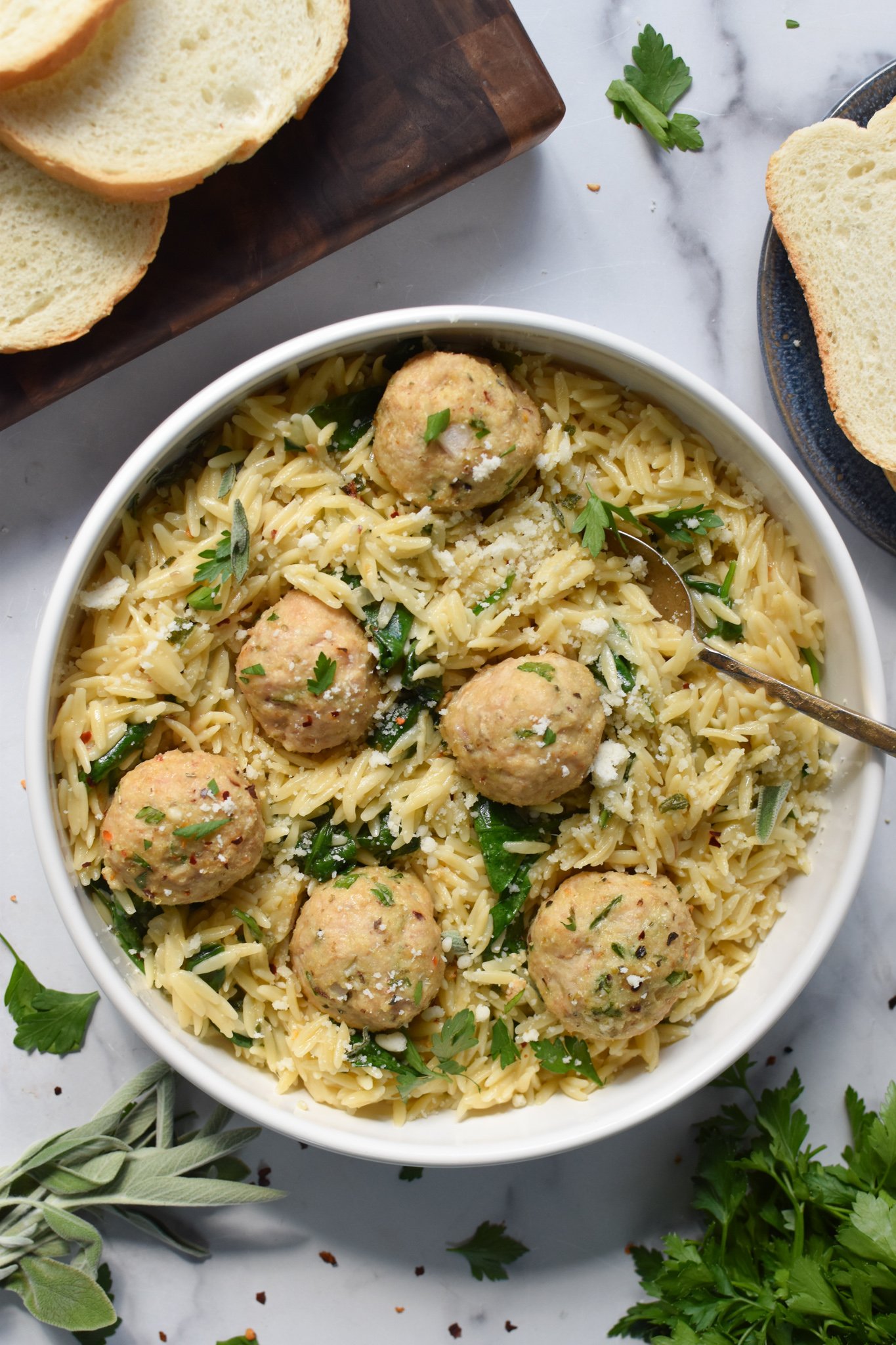 Baked Chicken Meatballs in a bowl with a fork. 