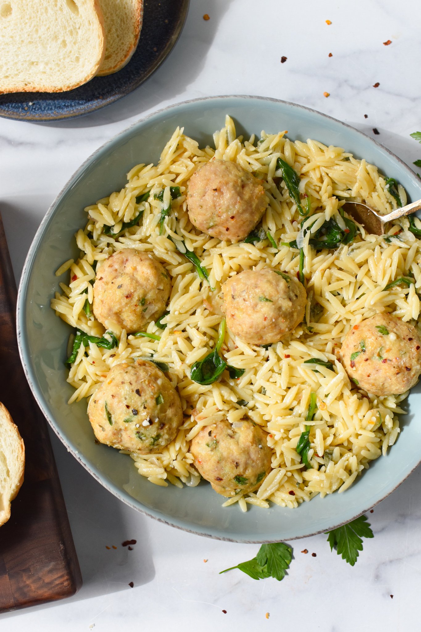 Baked Chicken Meatballs in a blue bowl. 