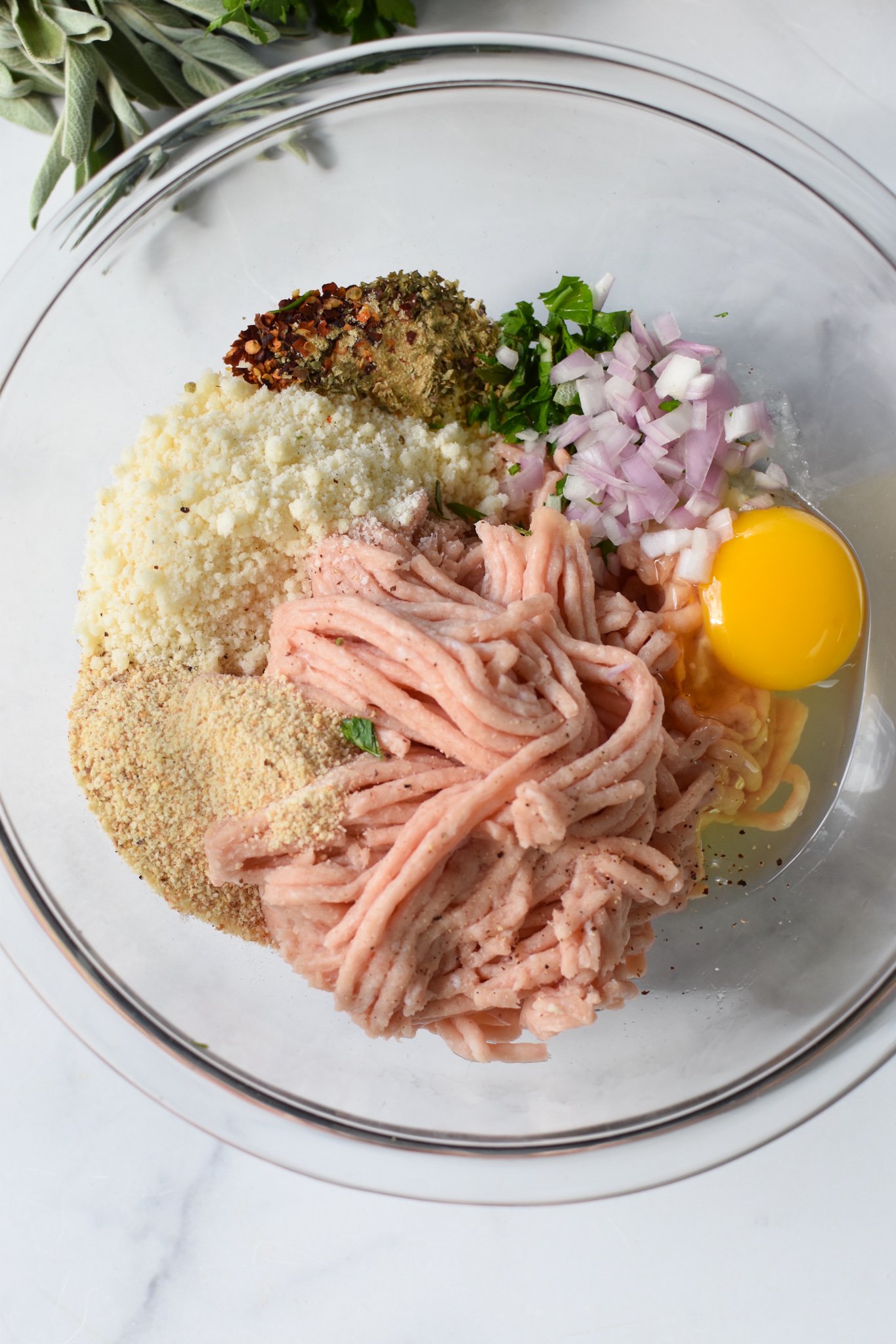 Baked Chicken Meatballs ingredients in a bowl. 