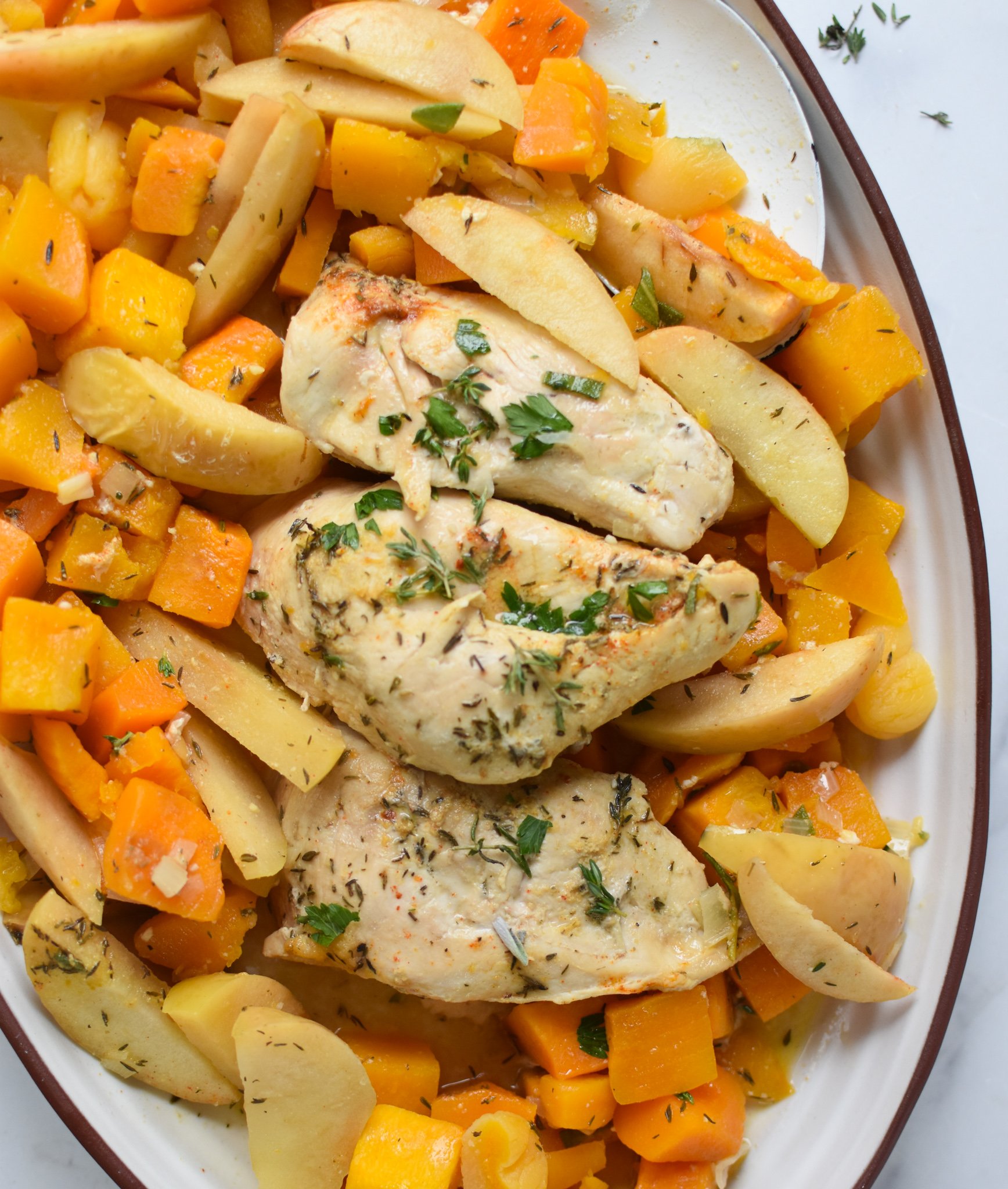 Crockpot Apple Chicken Breast Recipe on a white plate. 