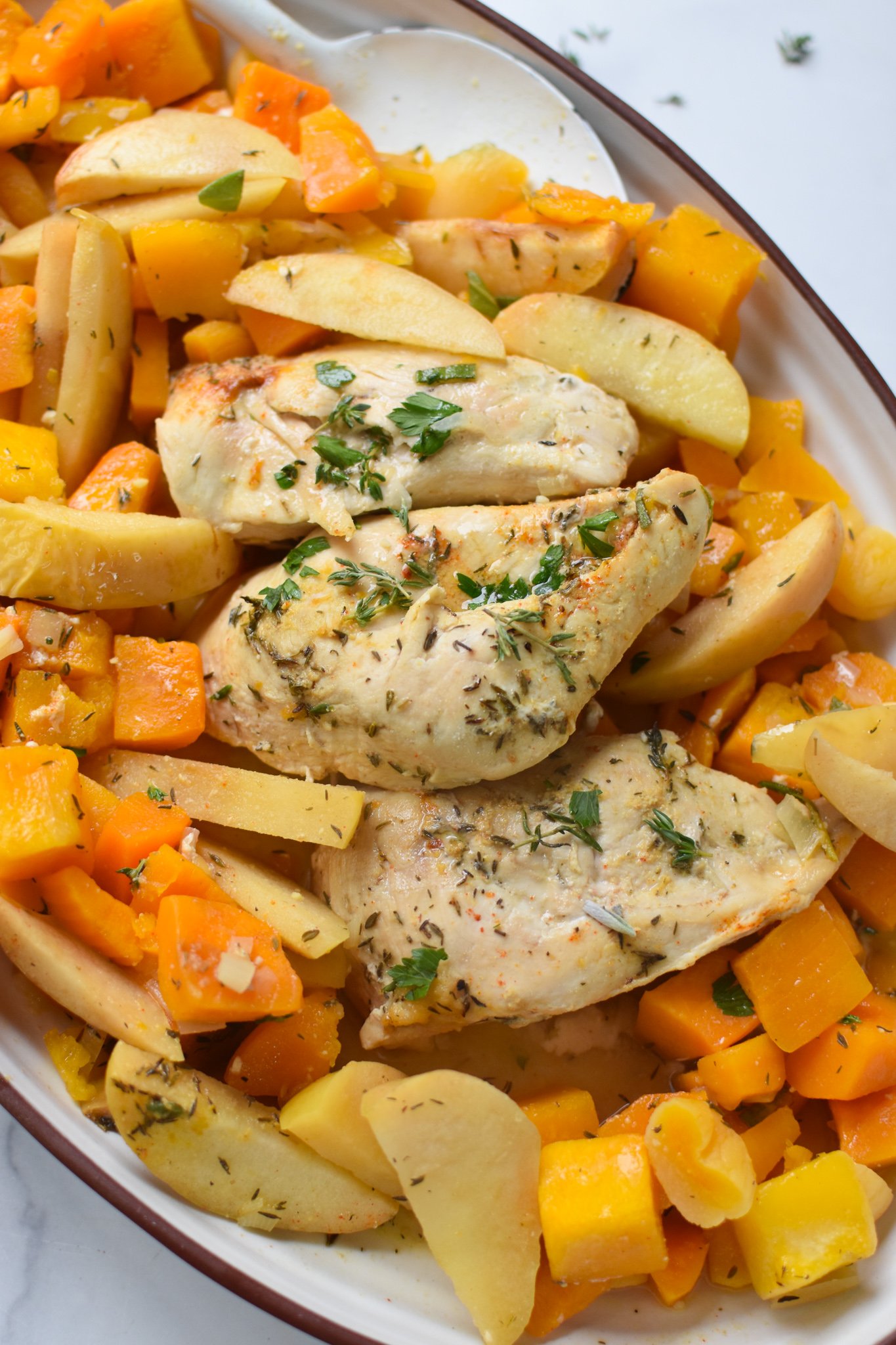 Crockpot Apple Chicken Breast Recipe on a white plate.