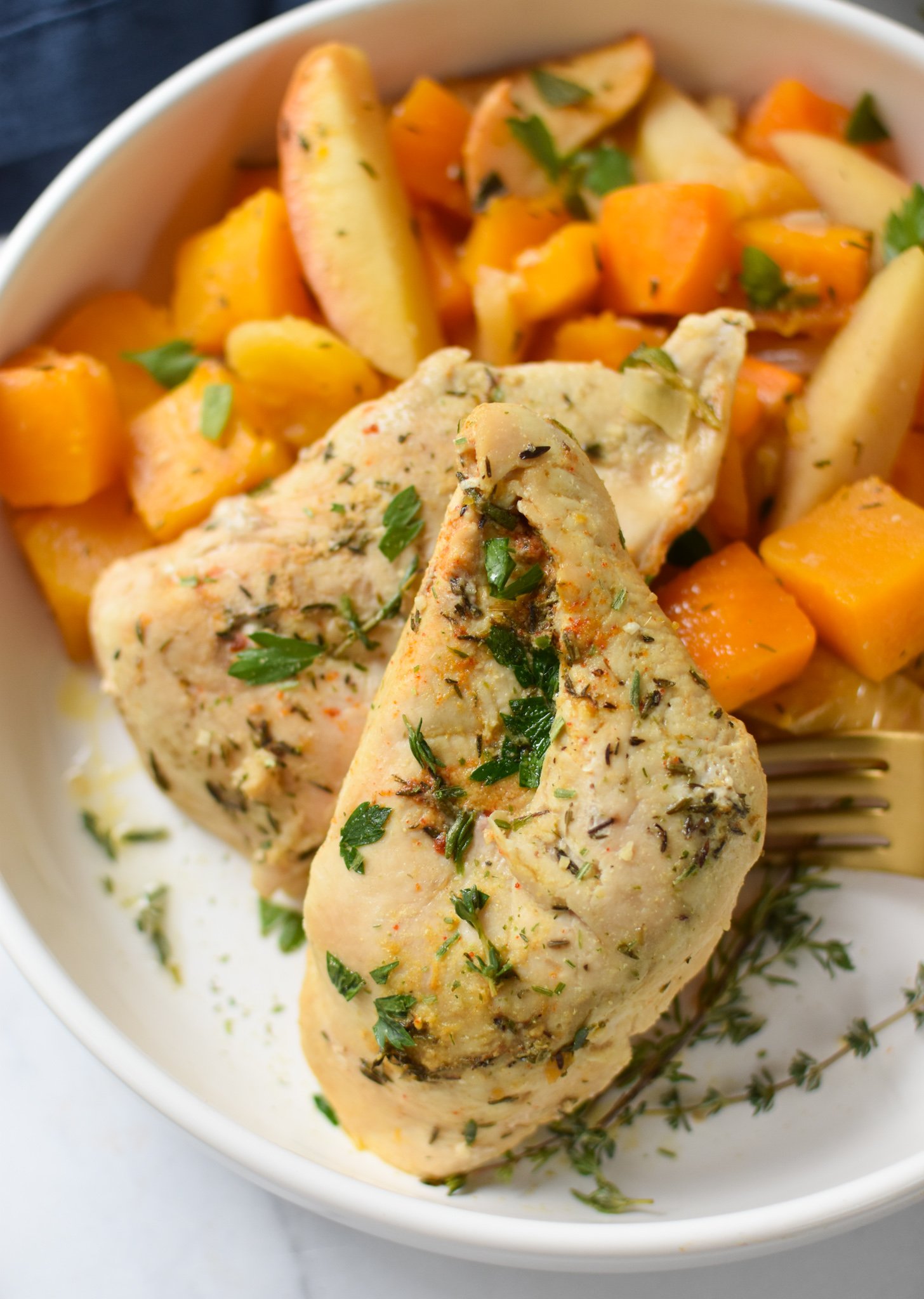 Crockpot Apple Chicken Breast Recipe on a white plate.