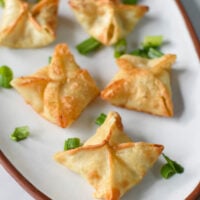 Air Fryer Crab Rangoon on a white platter.