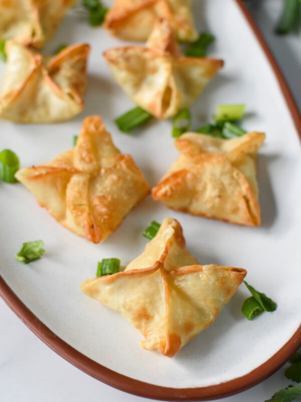 Air Fryer Crab Rangoon on a white platter.