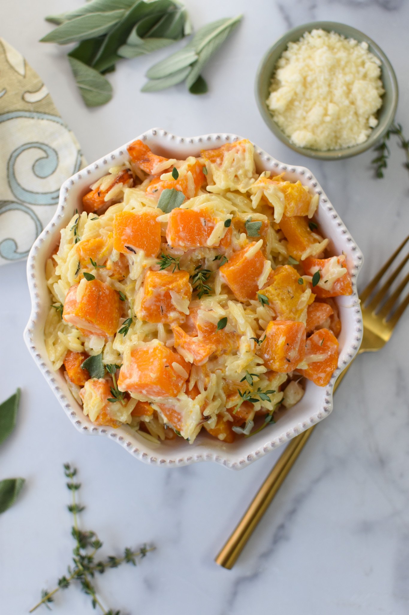 Cheesy Butternut Squash Orzo in a flower bowl.