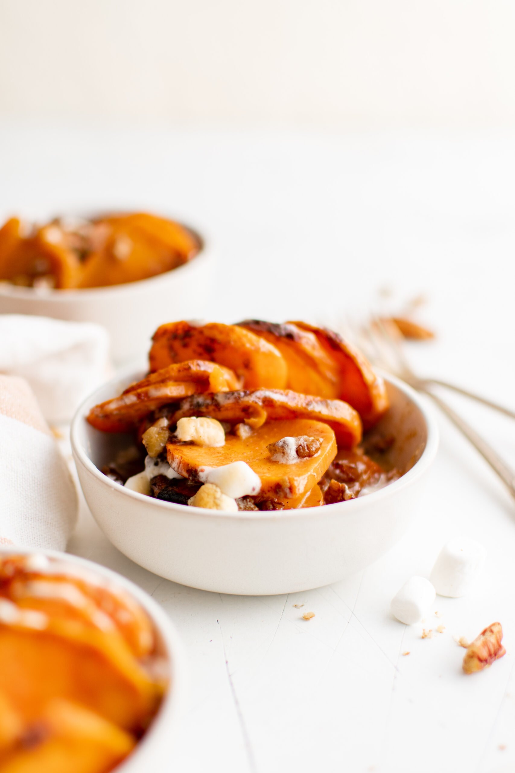 Easy Scalloped Sweet Potatoes in a white bowl. 