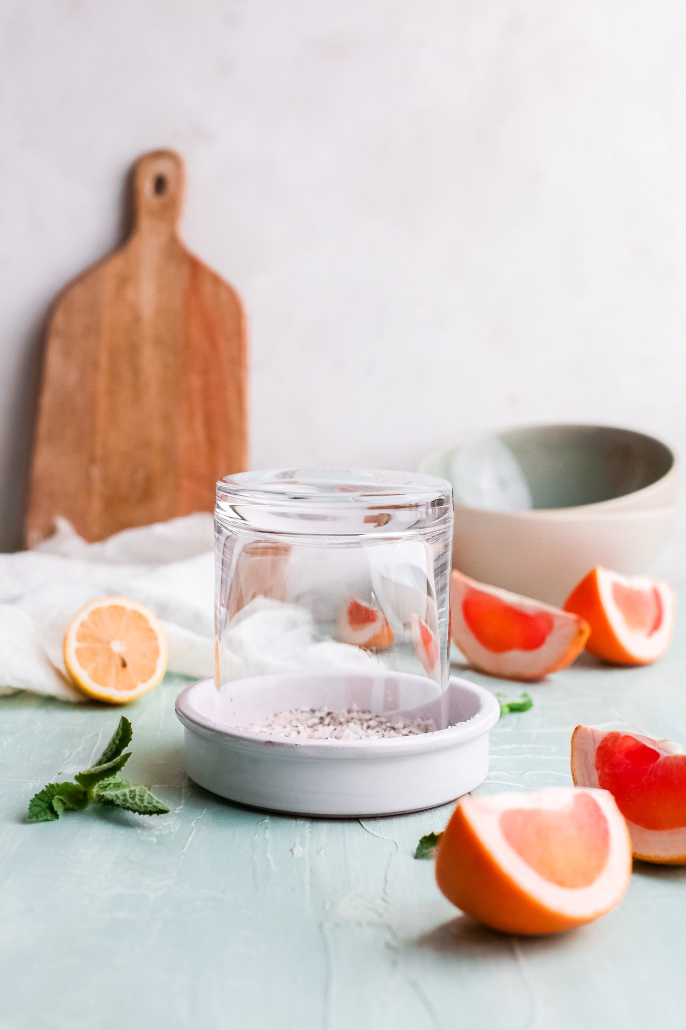 Grapefruit Paloma Cocktail glass in a salt rim dish.