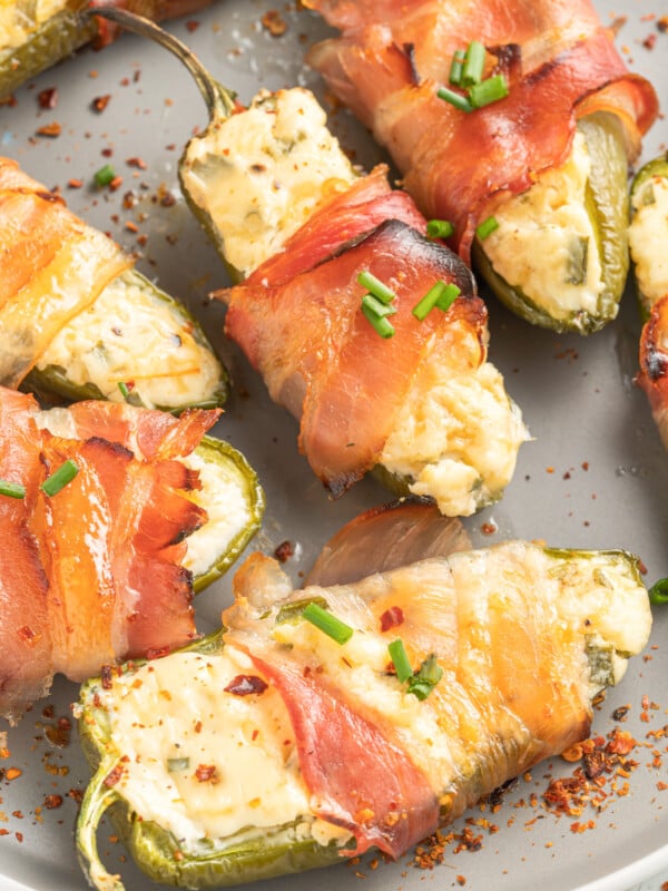 Jalapeño Poppers with Bacon on a grey plate.
