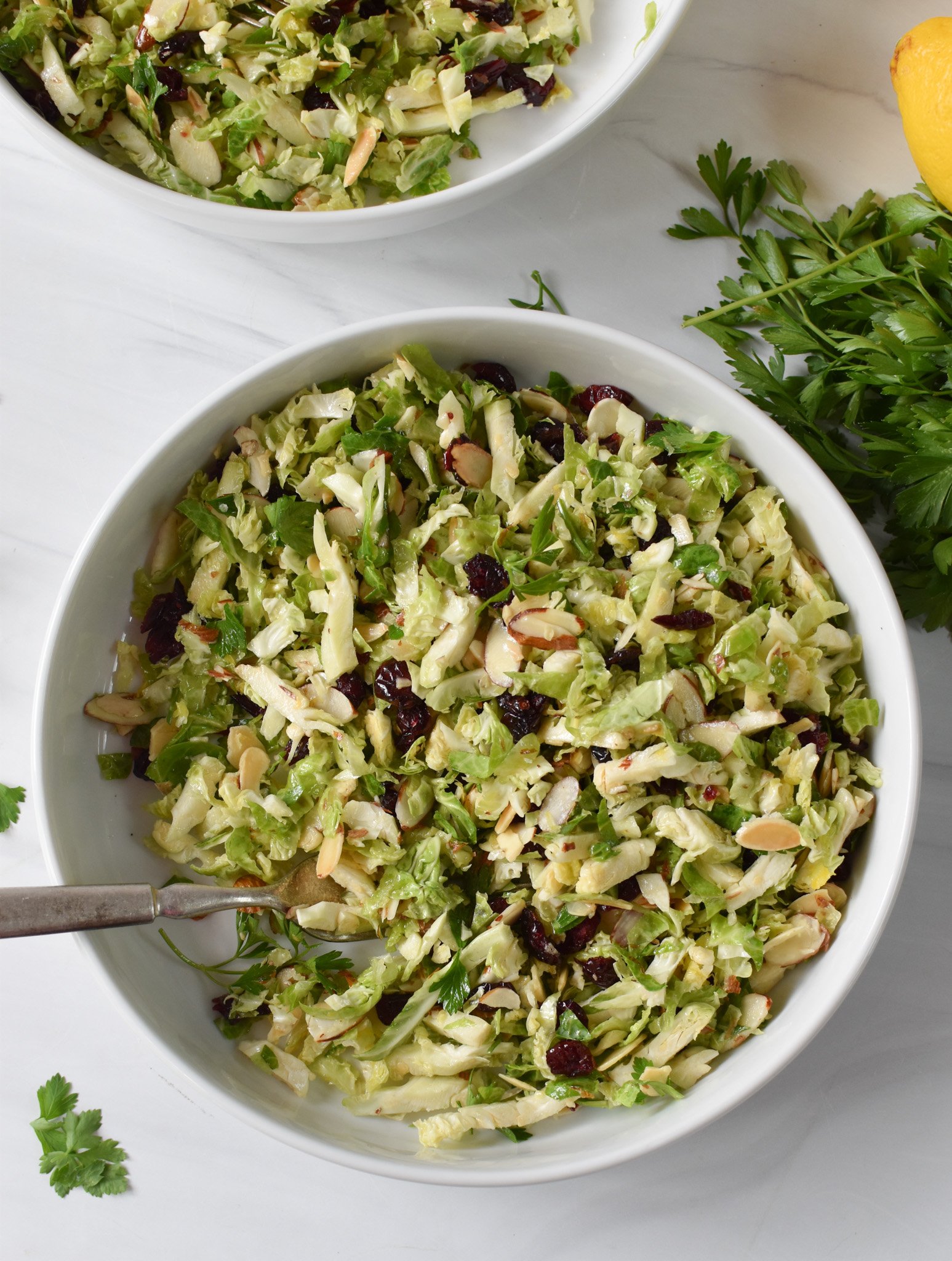 Lemon Brussels Sprout Slaw in a white bowl. 