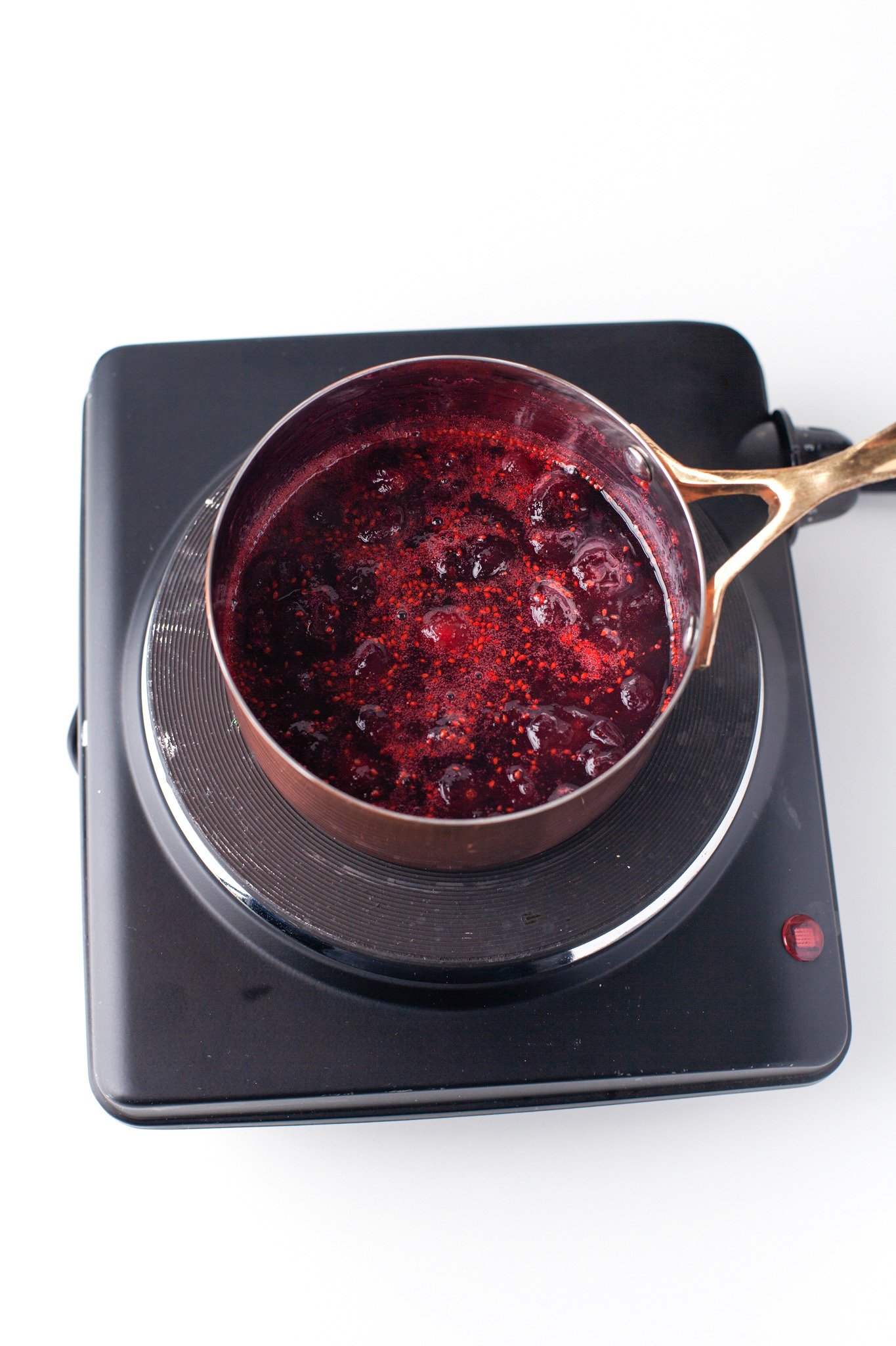 Cranberry Aperol Spritz cranberries in a pot
