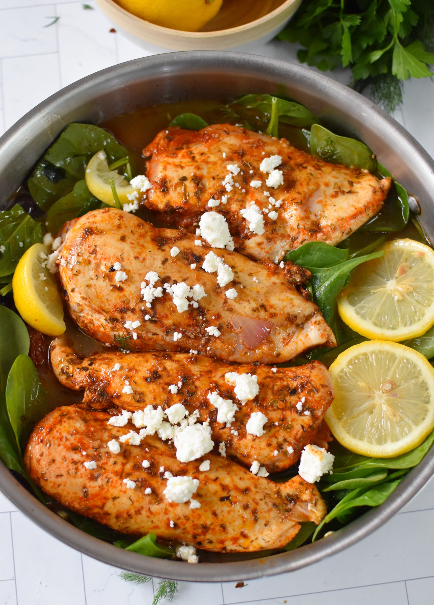 Sun-dried Tomato Farro Chicken Bake chicken in a skillet. 