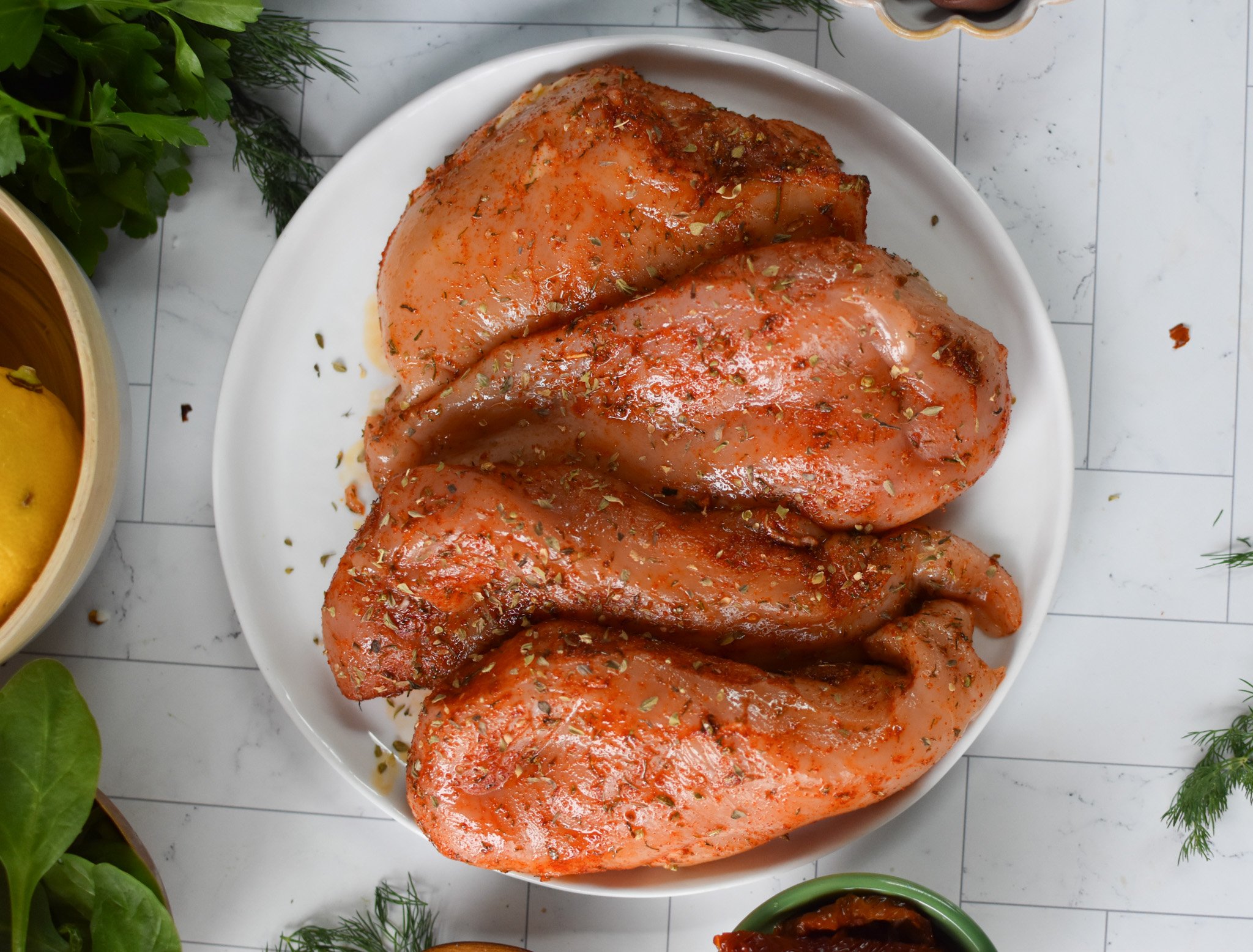 Sun-dried Tomato Farro Chicken Bake chicken with spices.