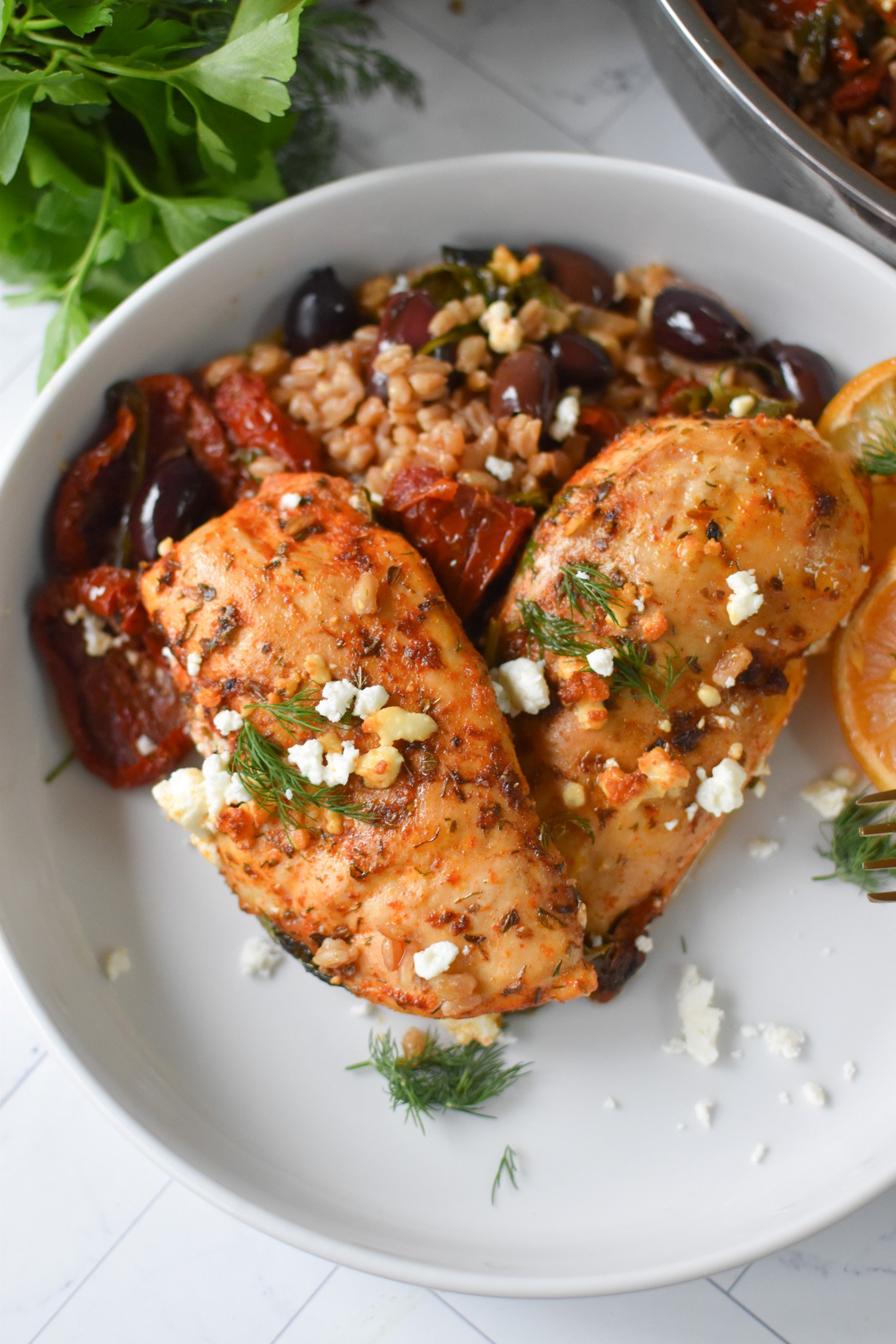Sun-dried Tomato Farro Chicken Bake in a white bowl. 