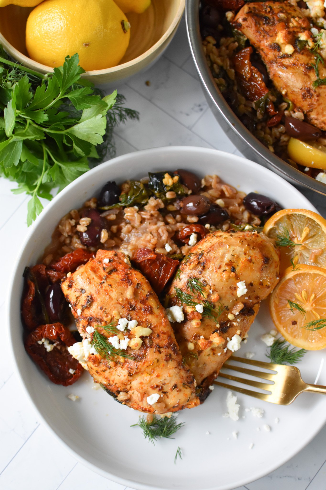 Sun-dried Tomato Farro Chicken Bake with a fork.