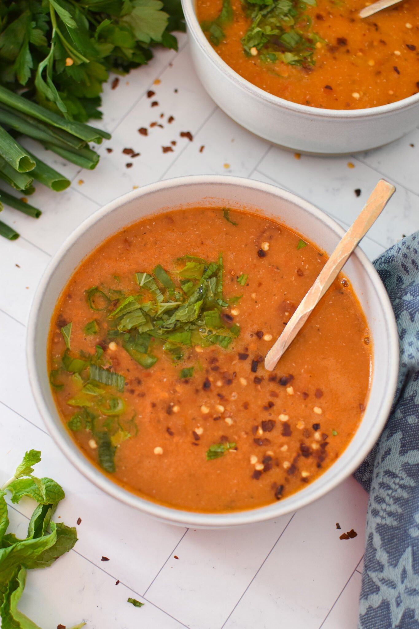 Turkish Lentil Soup with gold spoon.