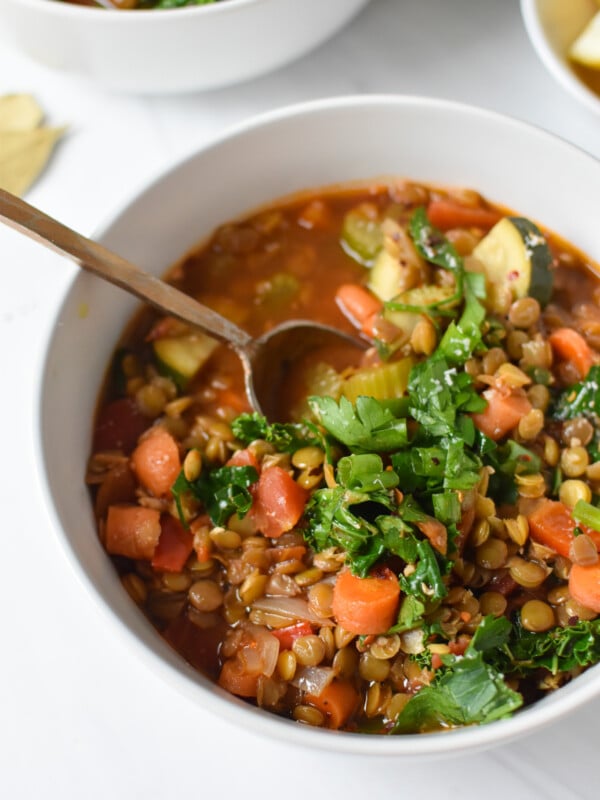 Italian Style Lentil Soup with a gold spoon.