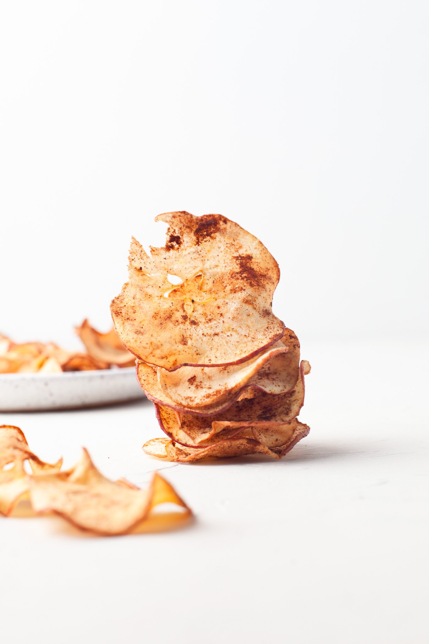 Easy Air Fryer Apple Chips stacked apples.