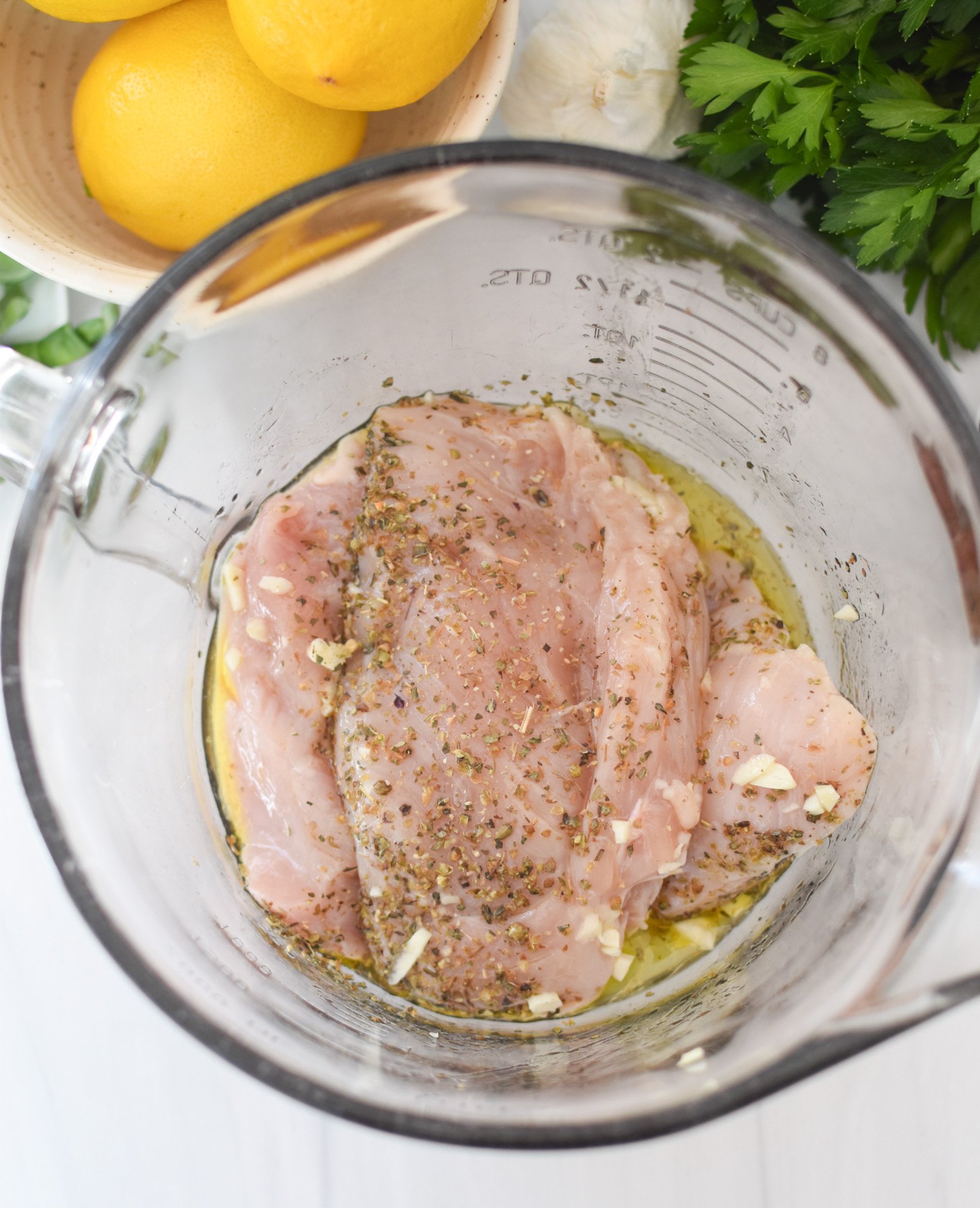 Chicken Bryan chicken in a bowl with marinade. 