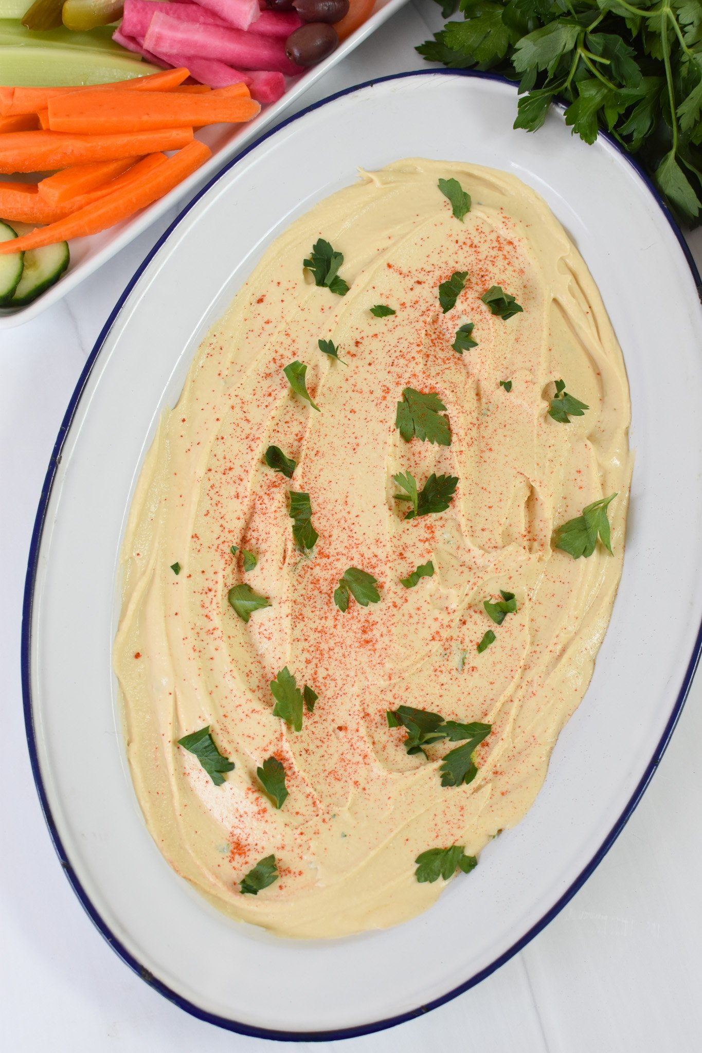 Ground Beef Layered Hummus layered on a plate. 