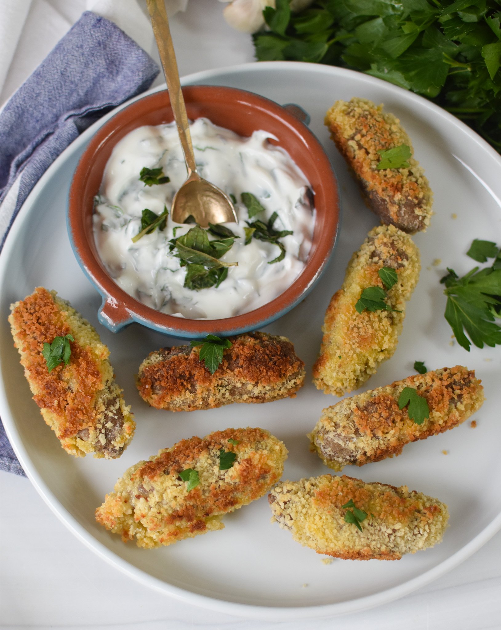 Lamb Croquettes on a white plate. 
