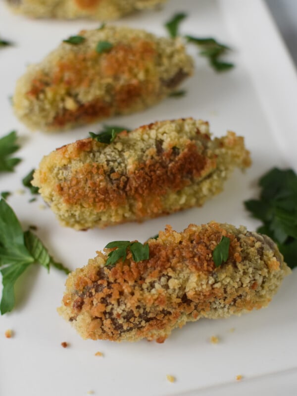 Lamb Croquettes on a white plate.