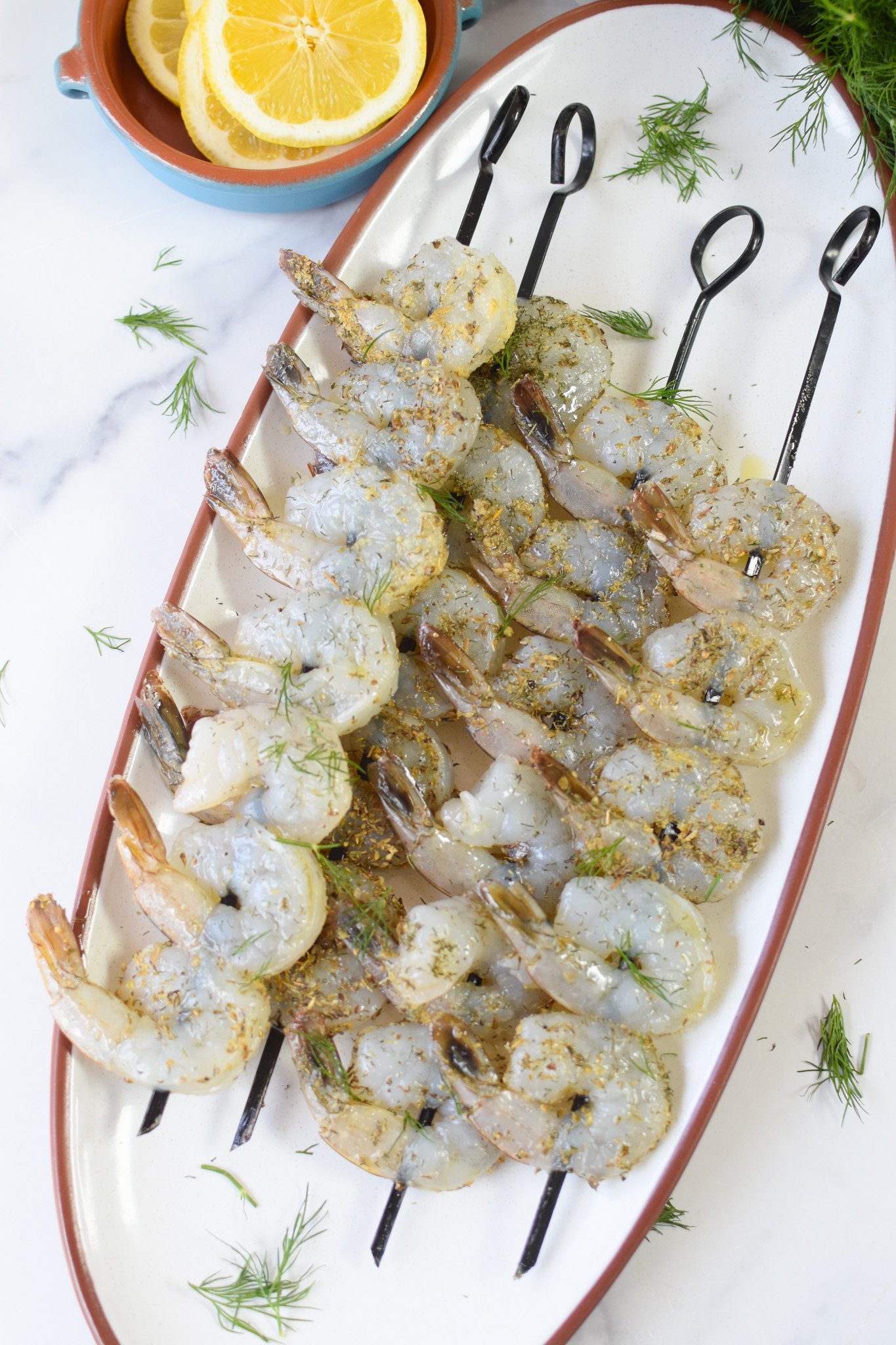 Greek Shrimp Marinade shrimp on skewers.