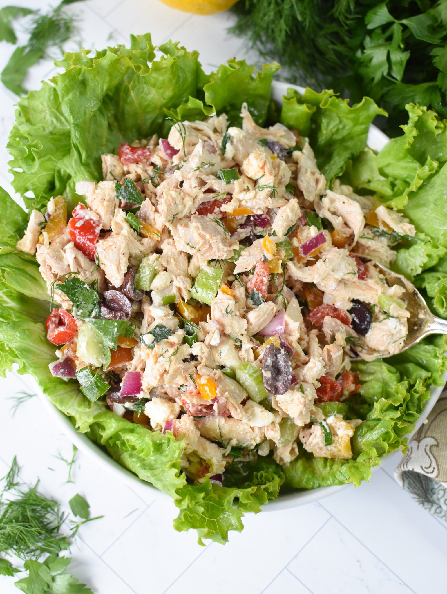 Healthy Mediterranean Chicken Salad over a bed of lettuce. 