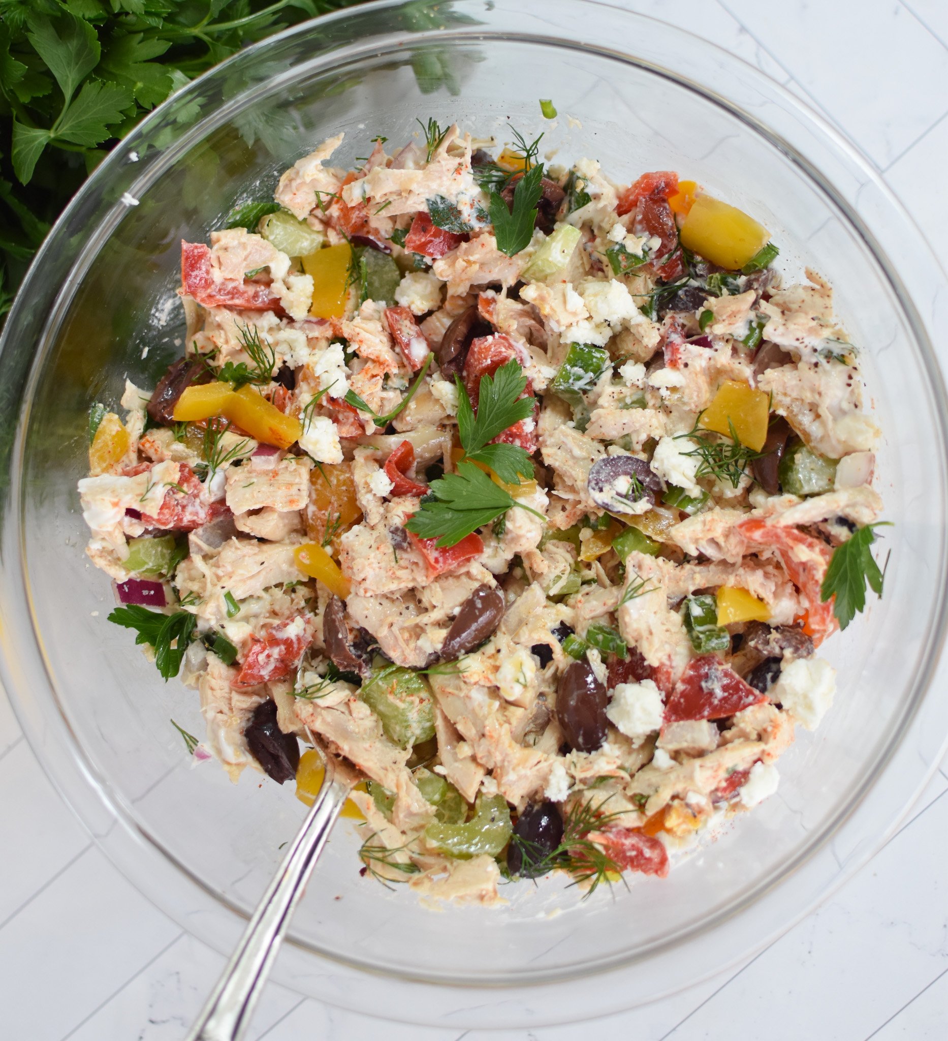 Healthy Mediterranean Chicken Salad ingredients mixed in bowl. 