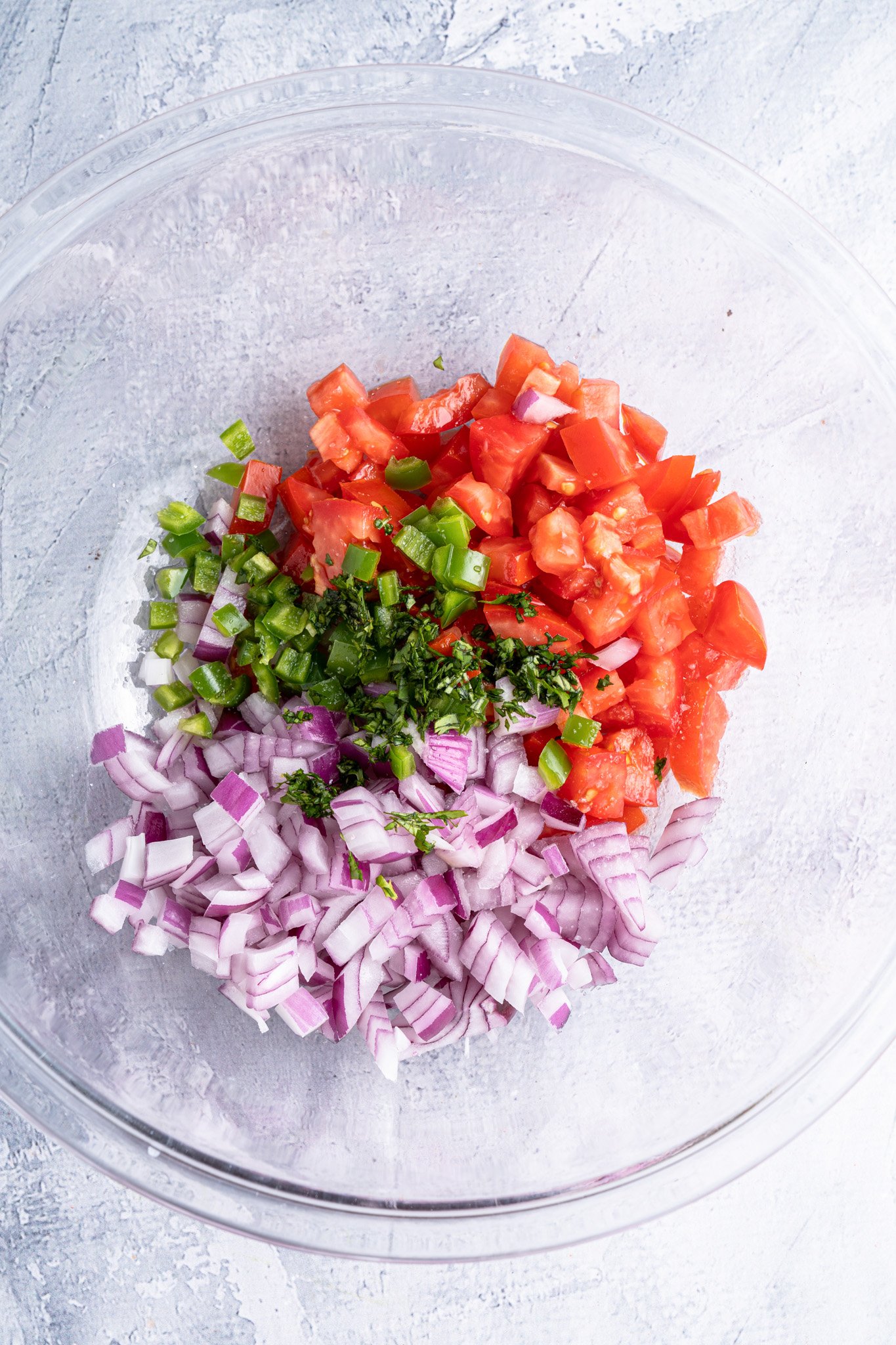 Homemade Pico de Gallo ingredients in a large bowl. 