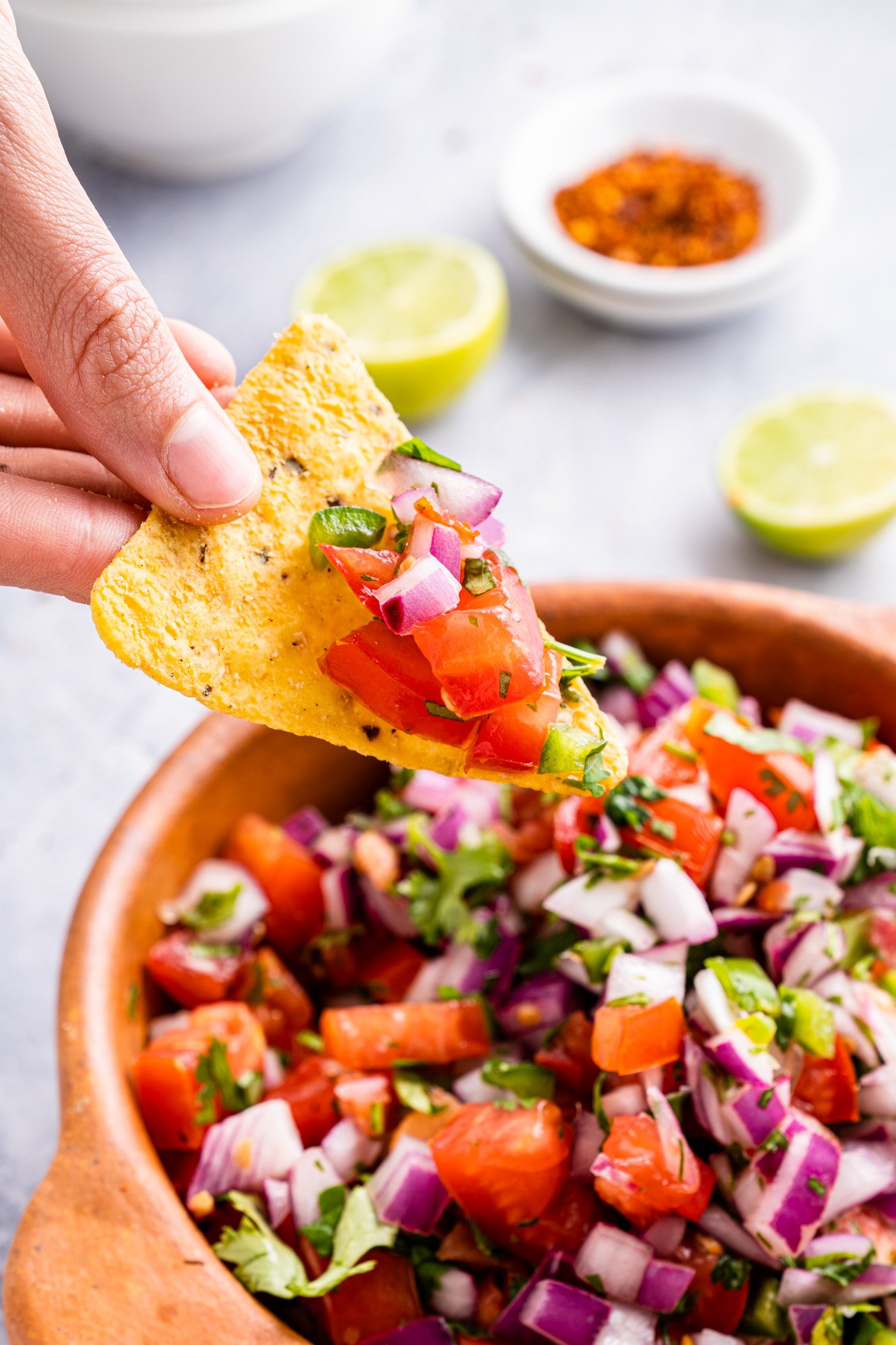 Homemade Pico de Gallo chip with salsa on it. 