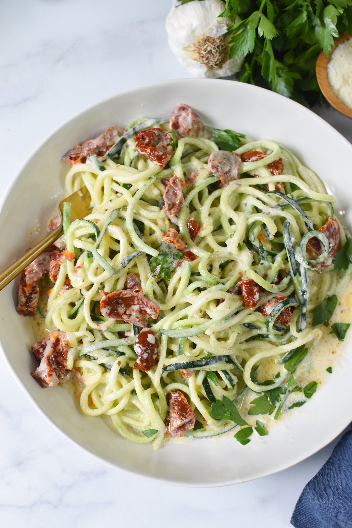 Alfredo Zoodles Recipe in a white bowl. 