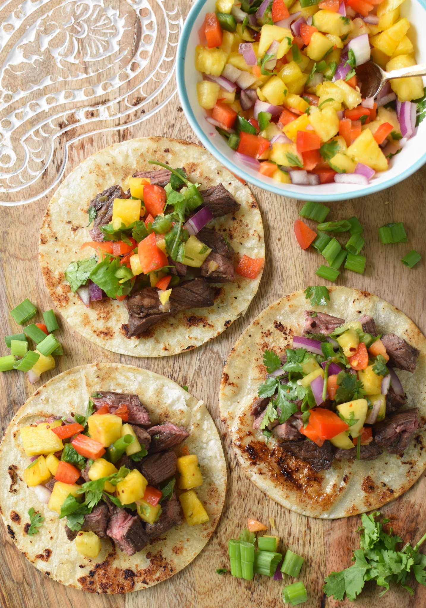 Balsamic Marinated Skirt Steak tacos on a cutting board. 