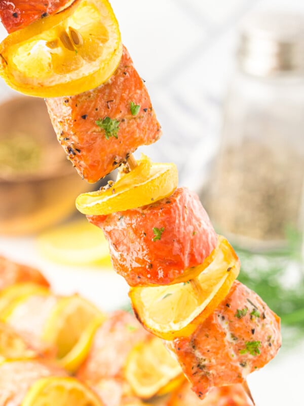 Easy Lemon Salmon Kabobs on a skewer with lemon.