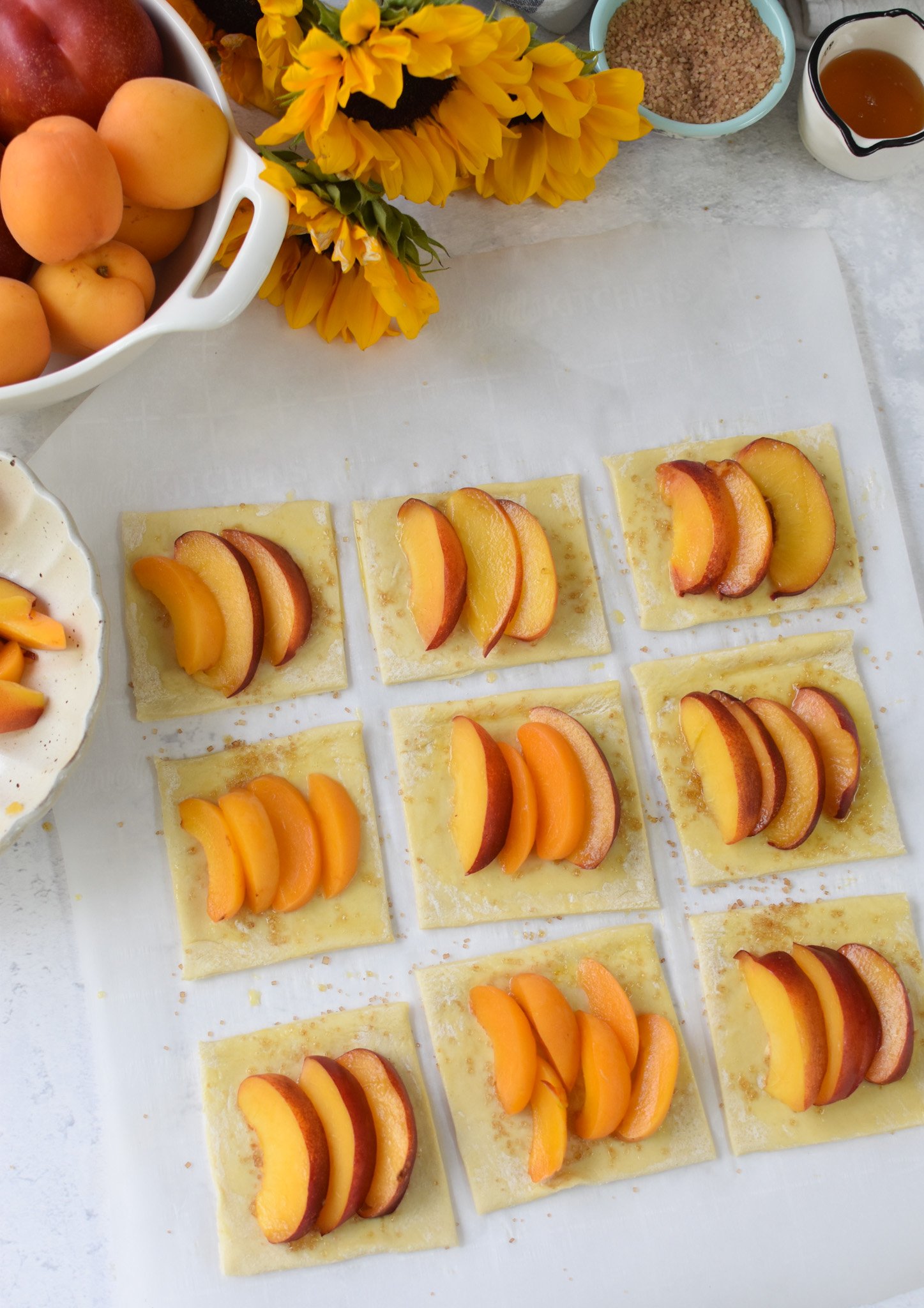 Easy Peach Tart peaches on the puff pastry before baking.