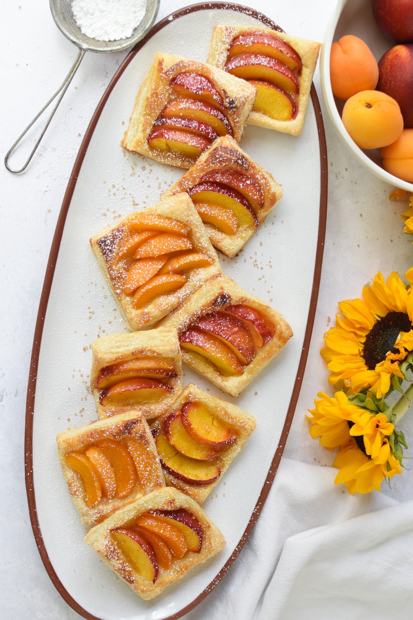 Easy Peach Tart on a white platter. 