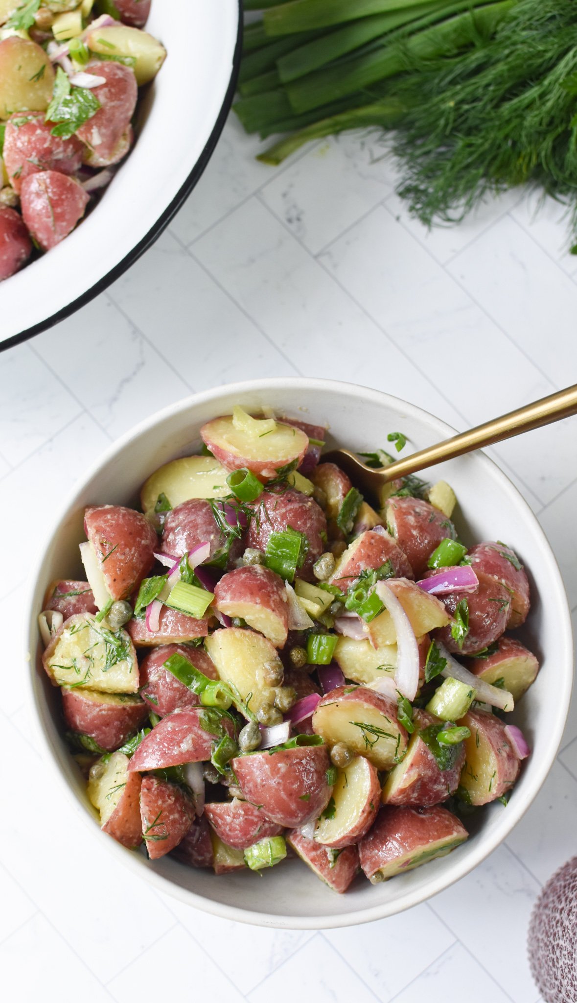 No Mayo Potato Salad with gold spoon.