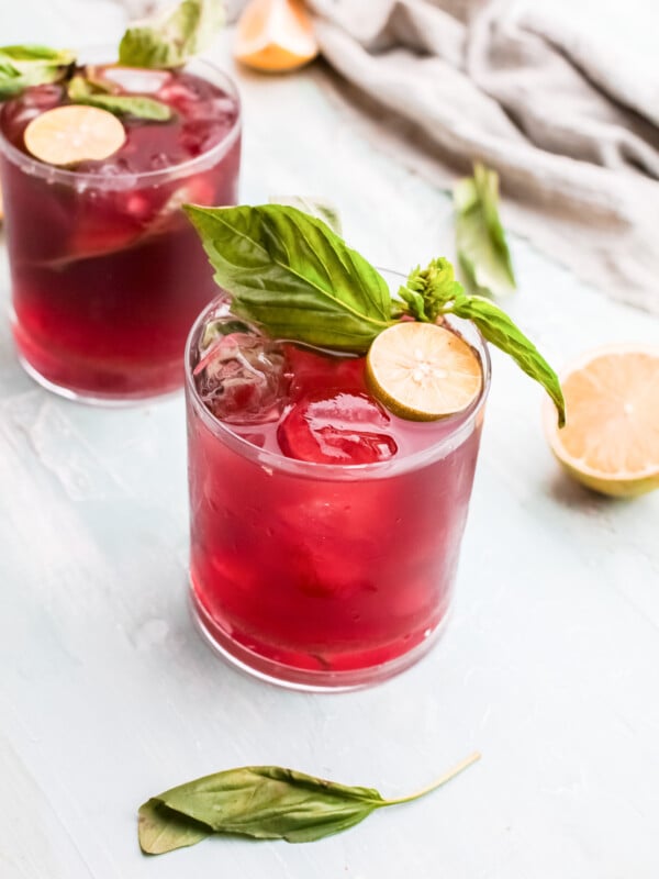 Vodka Cherry Limeade in a glade with basil.