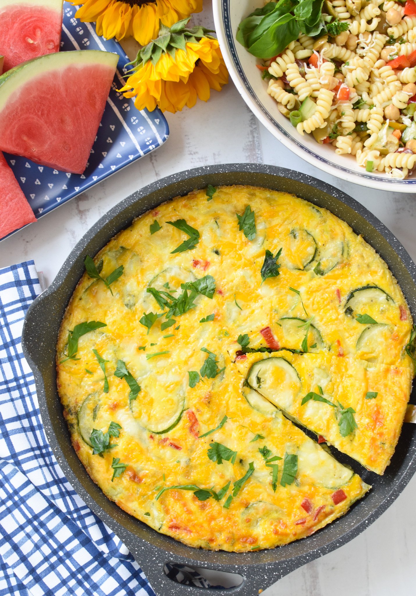 Zucchini Frittata Recipe on a blue napkin.