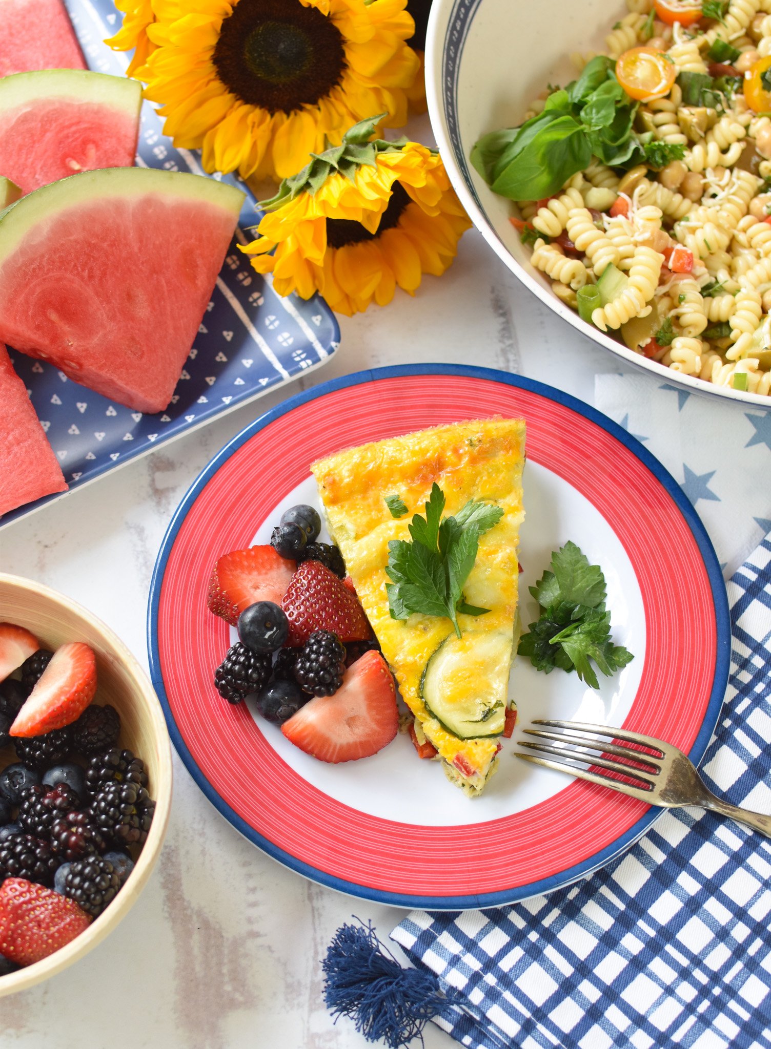 Zucchini Frittata Recipe on a blue and red plate.