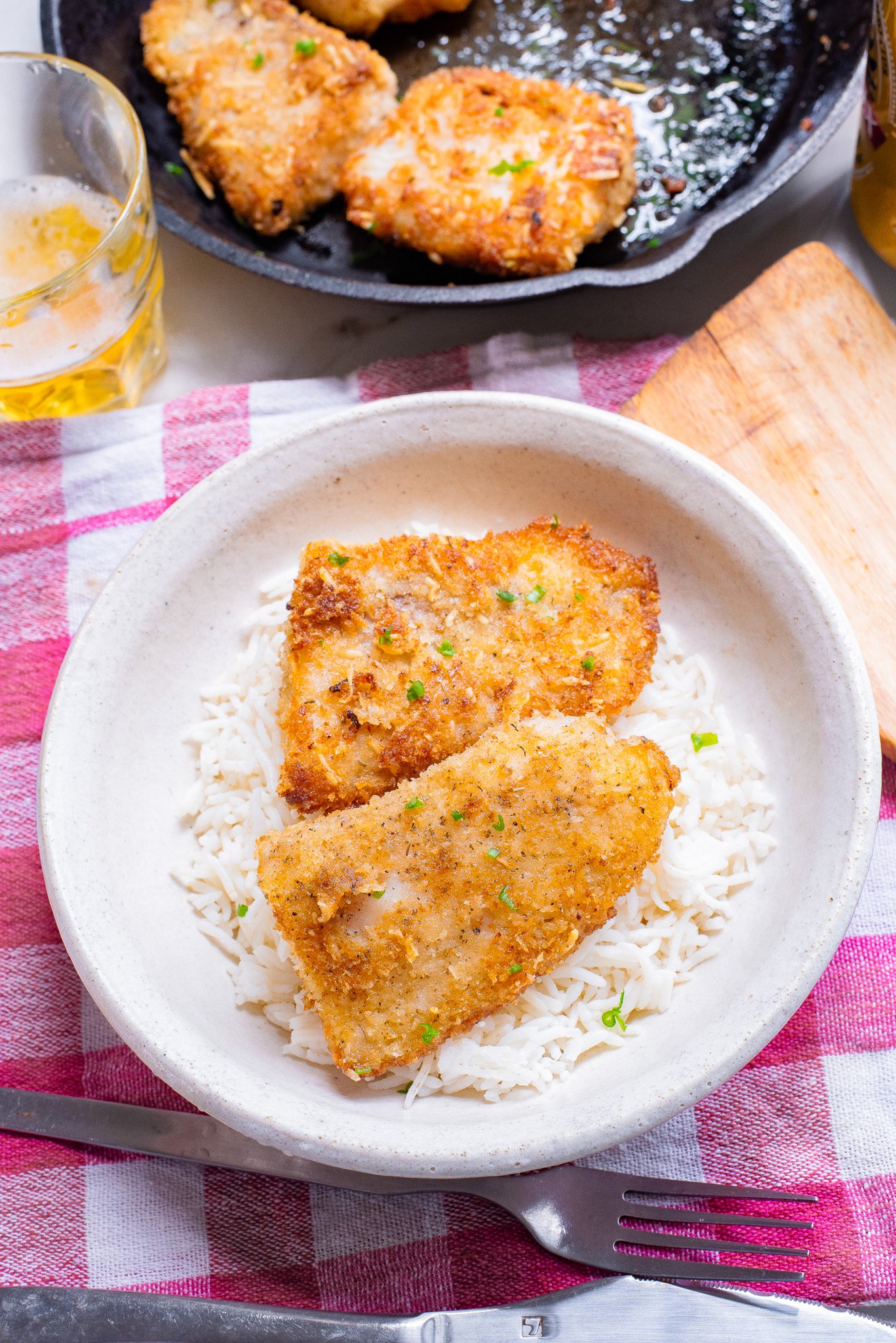 Easy Pan Fried Fish in a white bowl with rice.