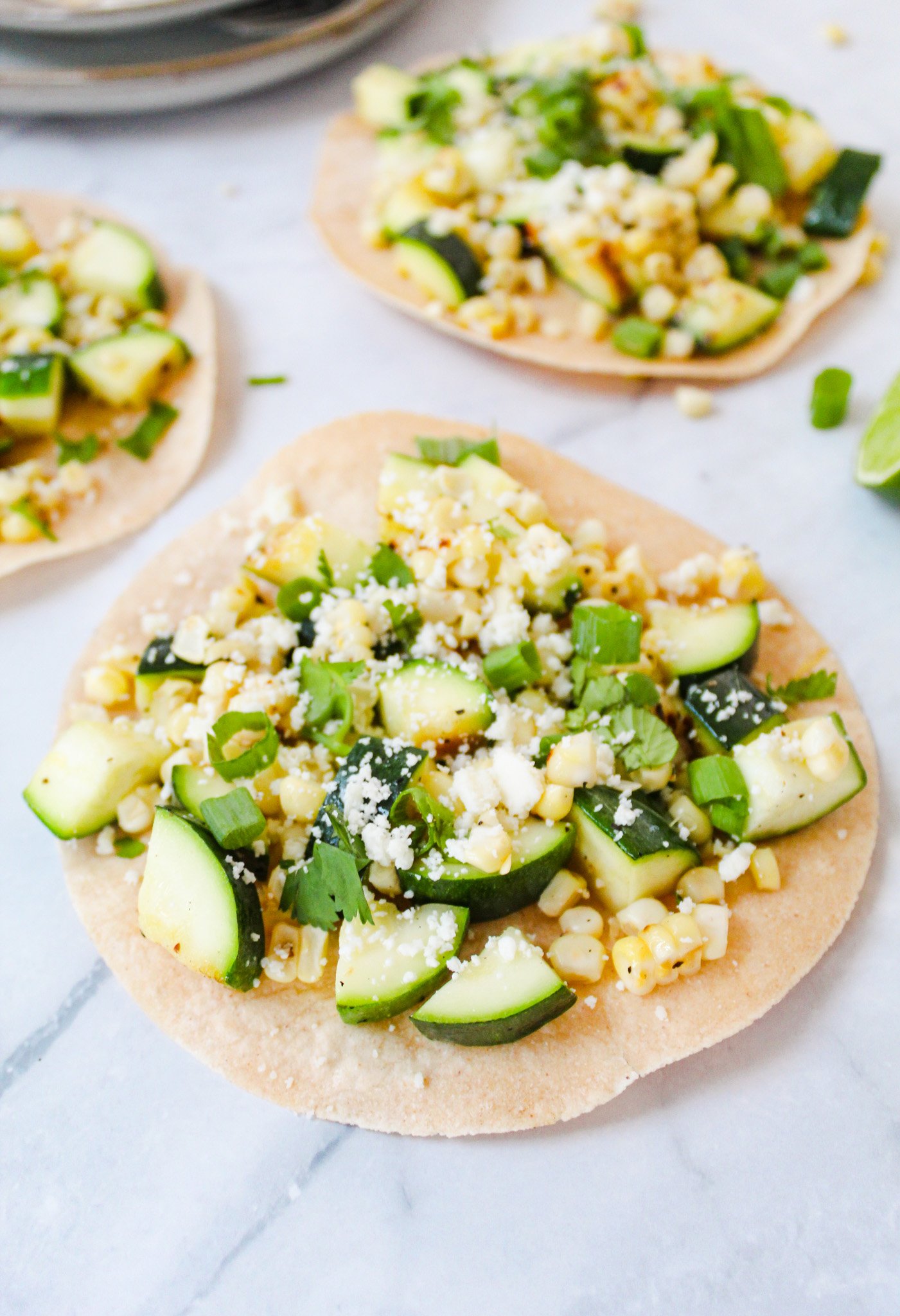 Easy Zucchini Tacos on a marble background