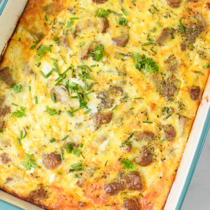 Cheese and Sausage Baked Eggs baked in a dish.