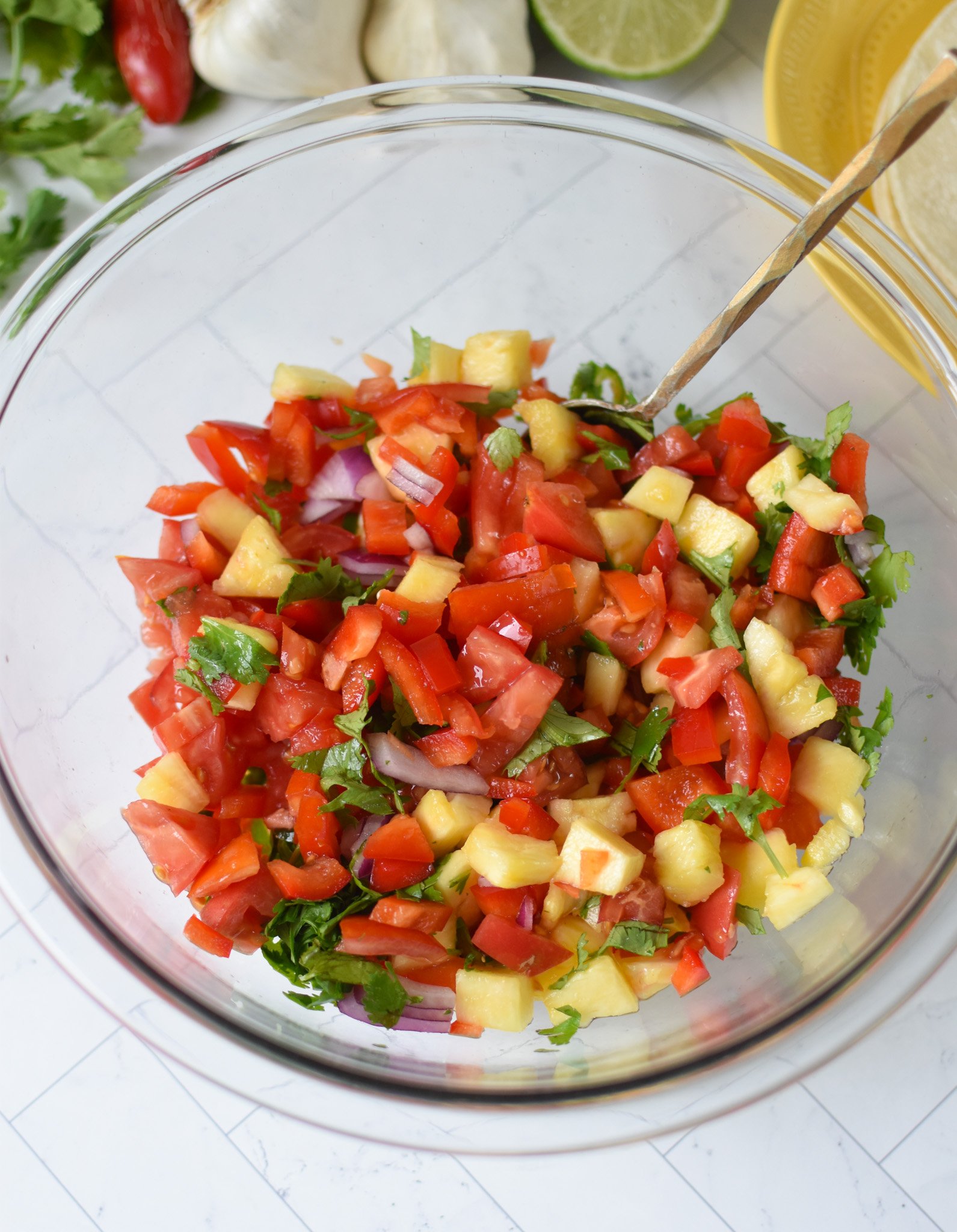 Easy Ground Pork Tacos salsa ingredients in a large bowl. 