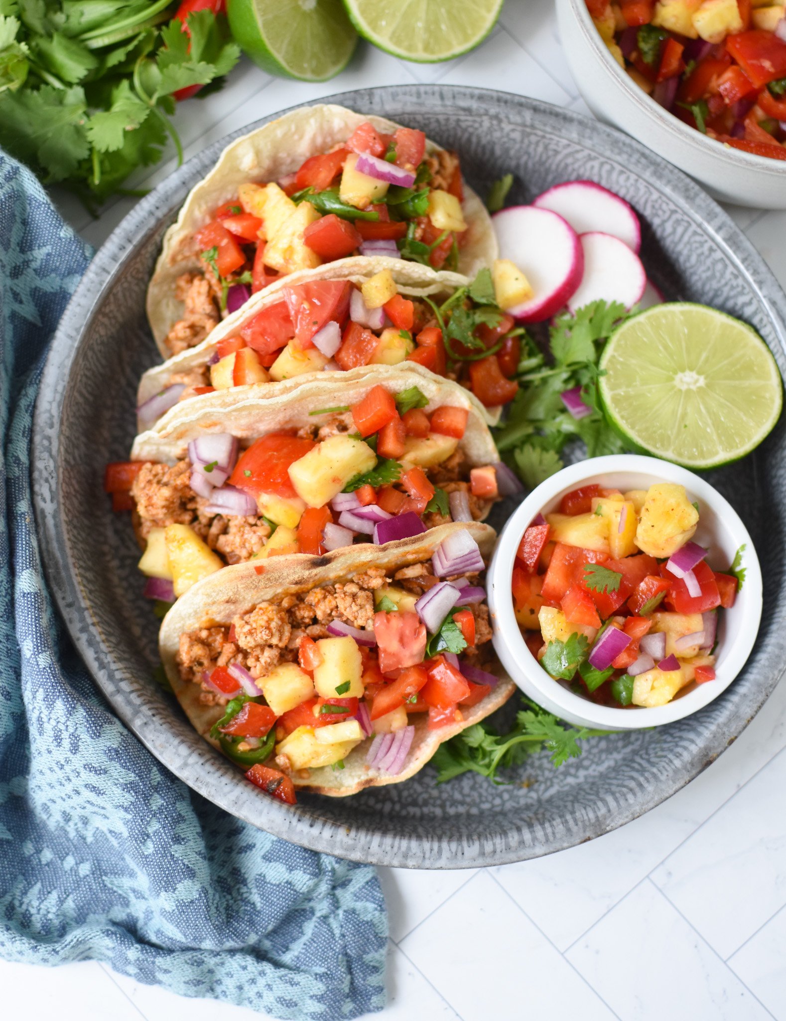 Easy Ground Pork Tacos with radishes and limes. 