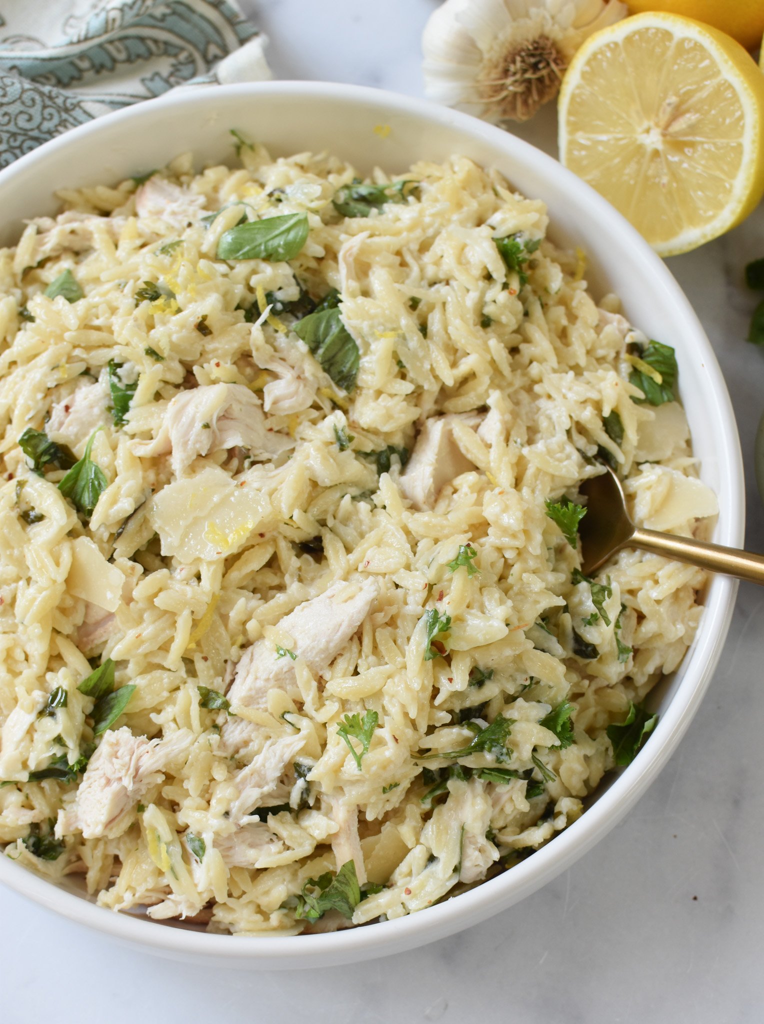 Lemon Chicken Orzo with gold spoon. 