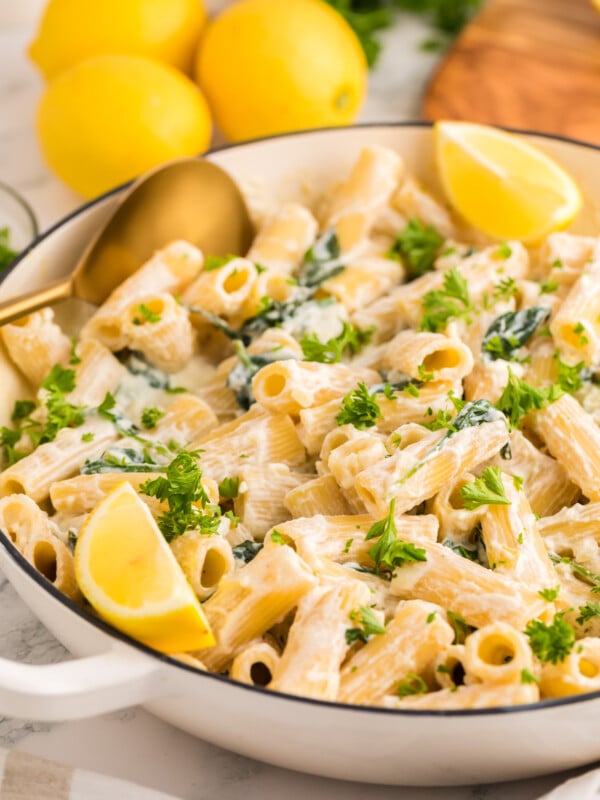Lemon Ricotta Pasta in a pot with a gold serving spoon.