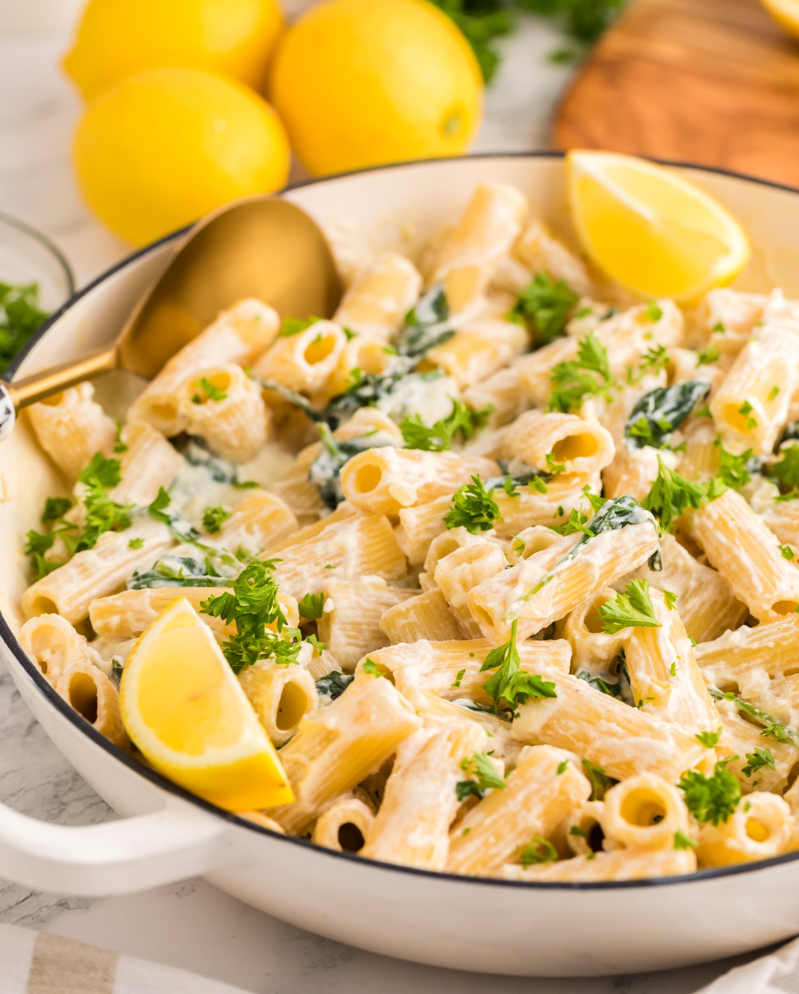 Lemon Ricotta Pasta in a pot with a gold serving spoon.