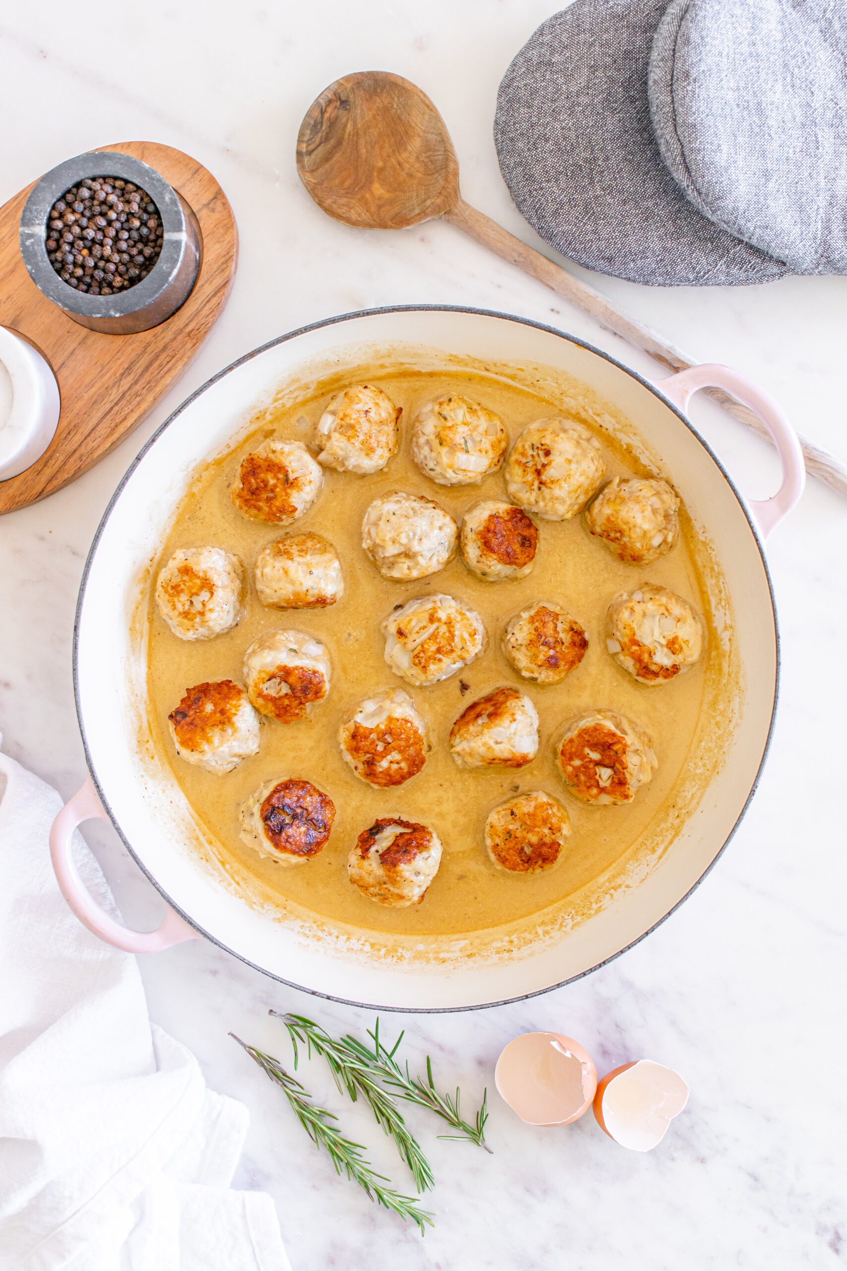 Maple Dijon Turkey Meatballs in a sauce in a dutch oven.