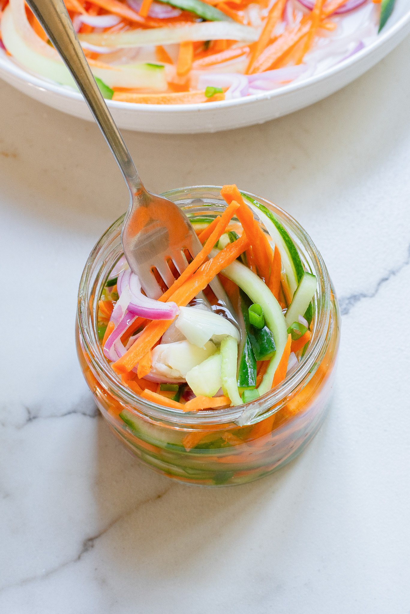 Quick Pickled Vegetables in a jar with a fork.