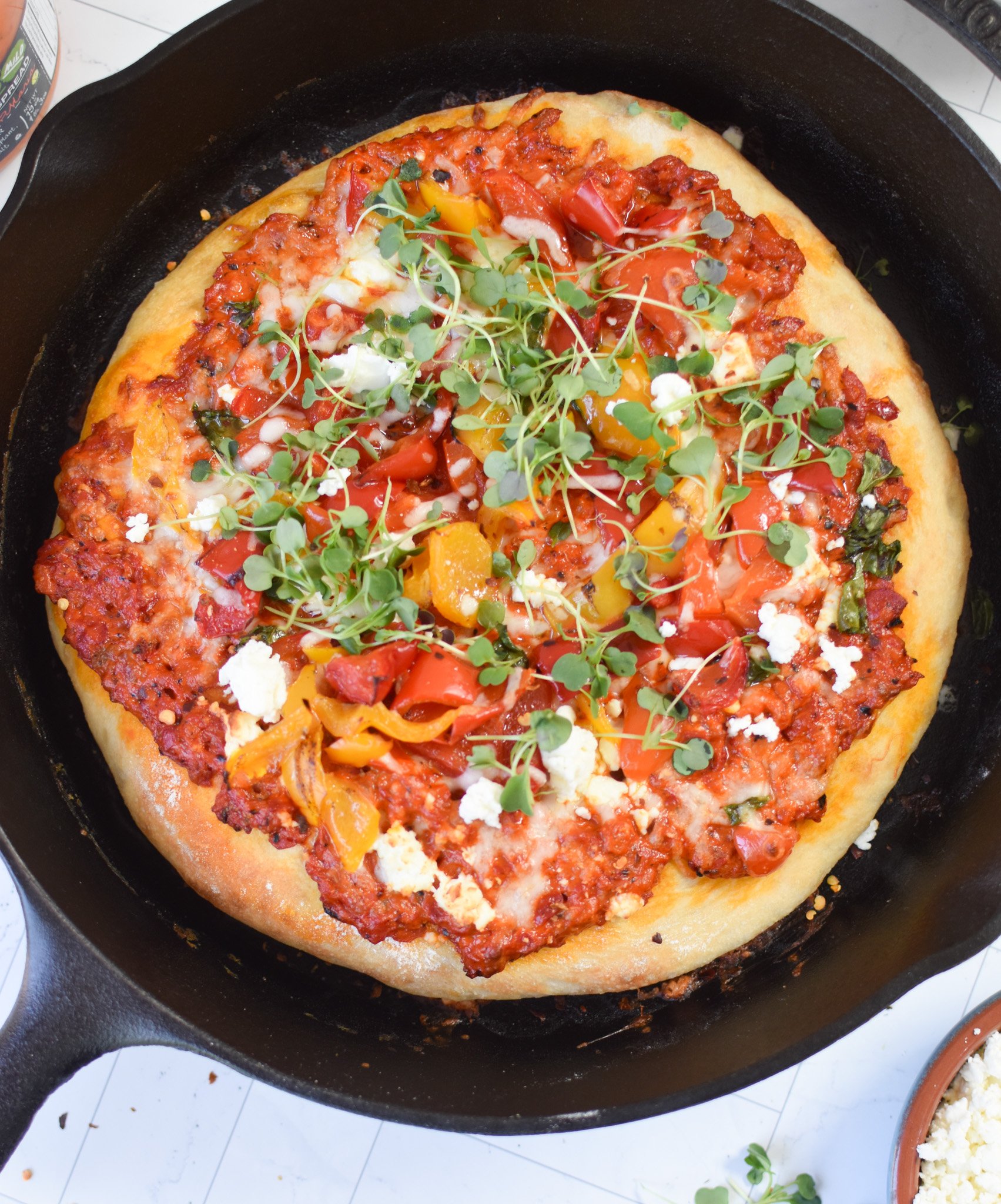 Cast Iron Mediterranean Pizza in a cast iron skillet. 